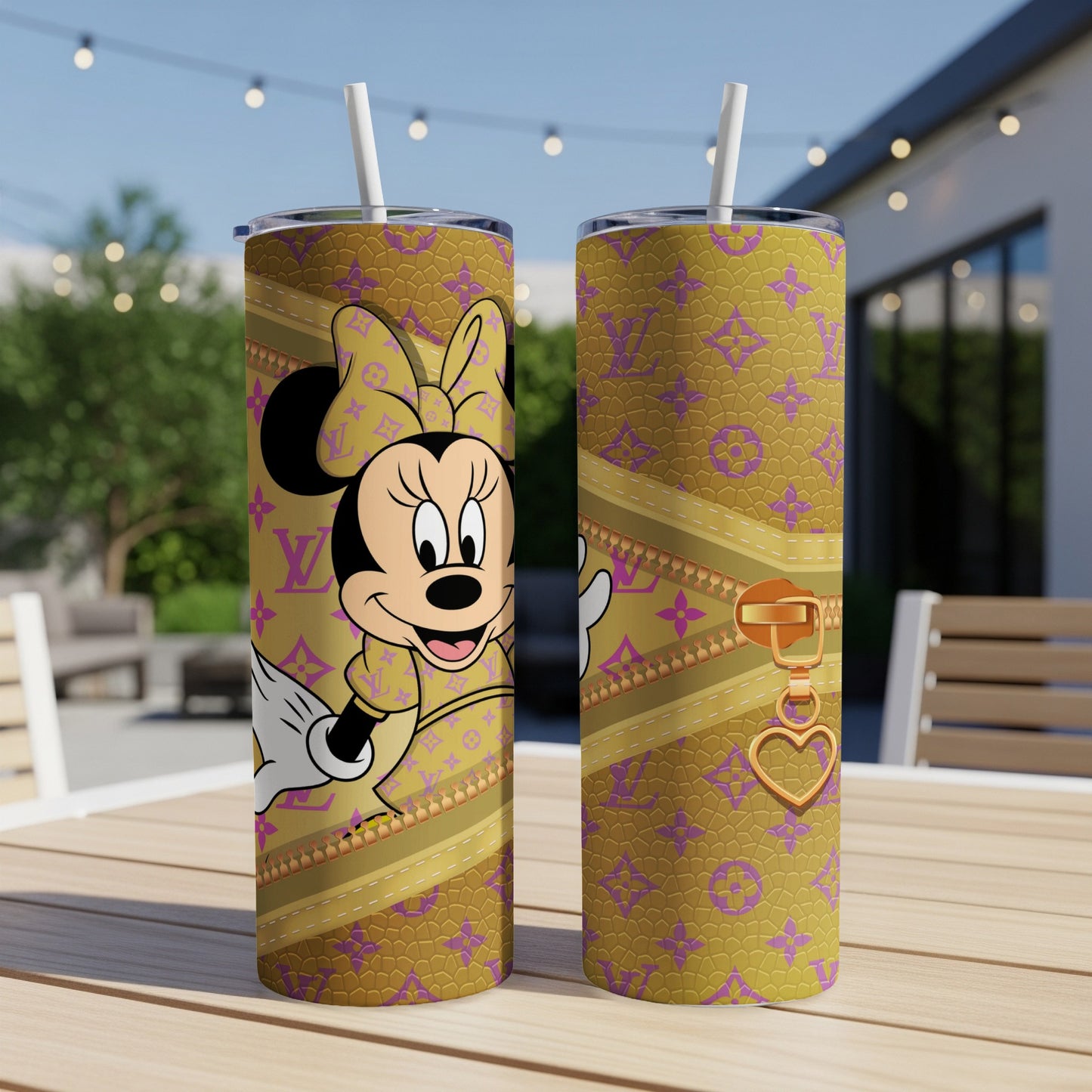 Minnie Mouse in yellow and purple designer print on a tumbler with gold zipper and heart charm.