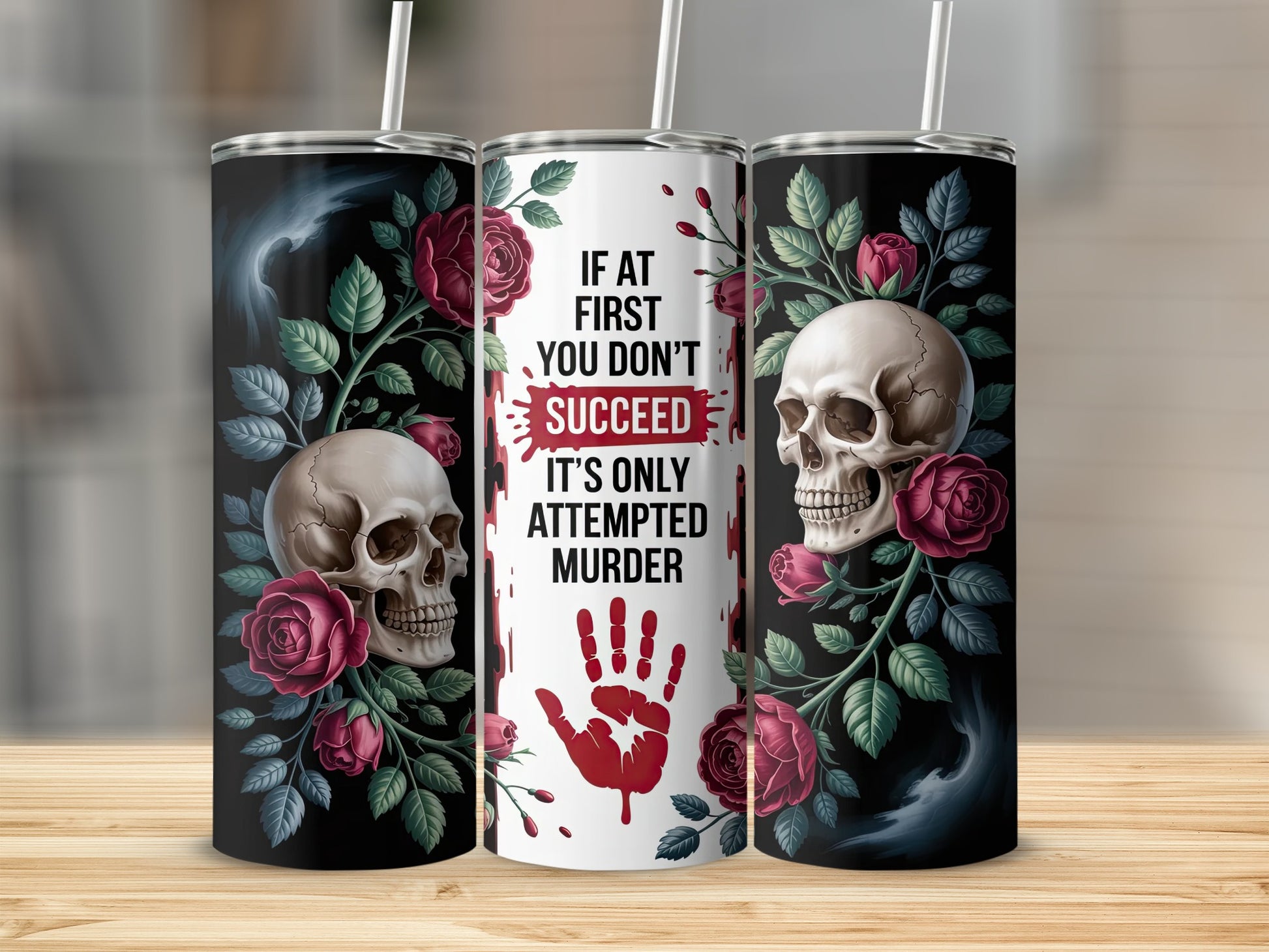 Tumbler with skull, roses, and "If at first you don't succeed, it's only attempted murder" text.