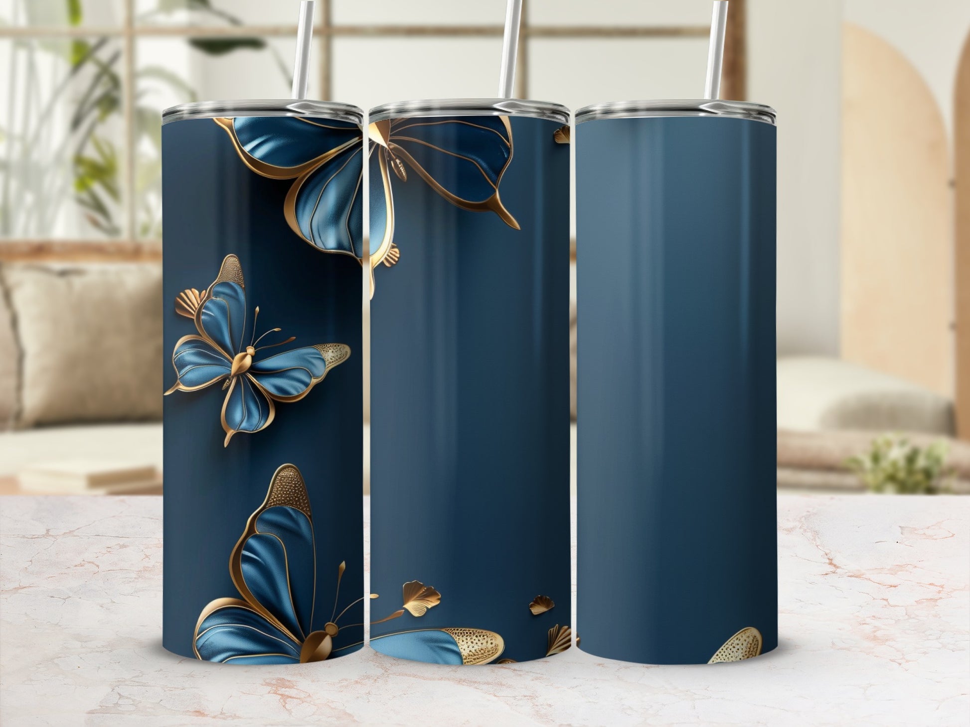 Three navy tumblers with gold butterfly designs and straws.