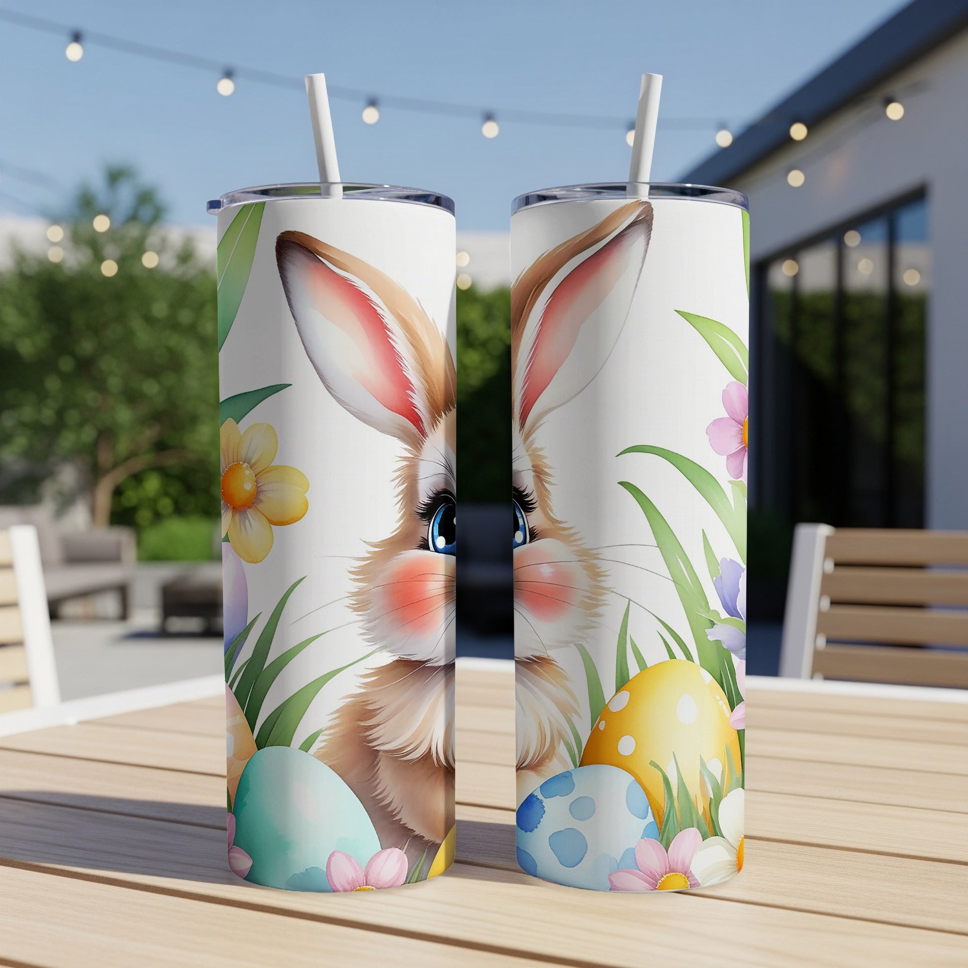 Two Easter-themed tumblers with a bunny, eggs, and flowers.