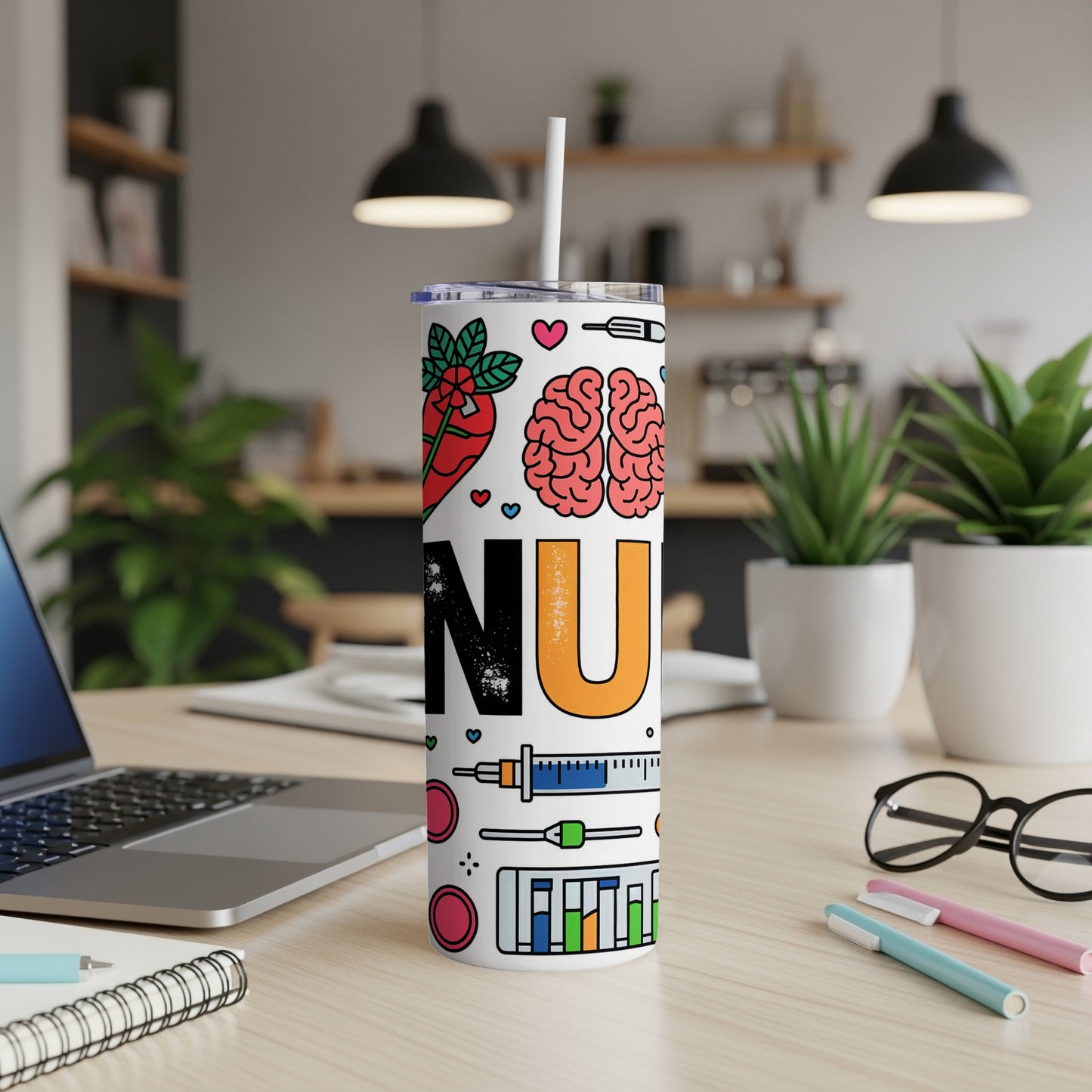 White tumbler with medical icons and "NU" text on a desk.