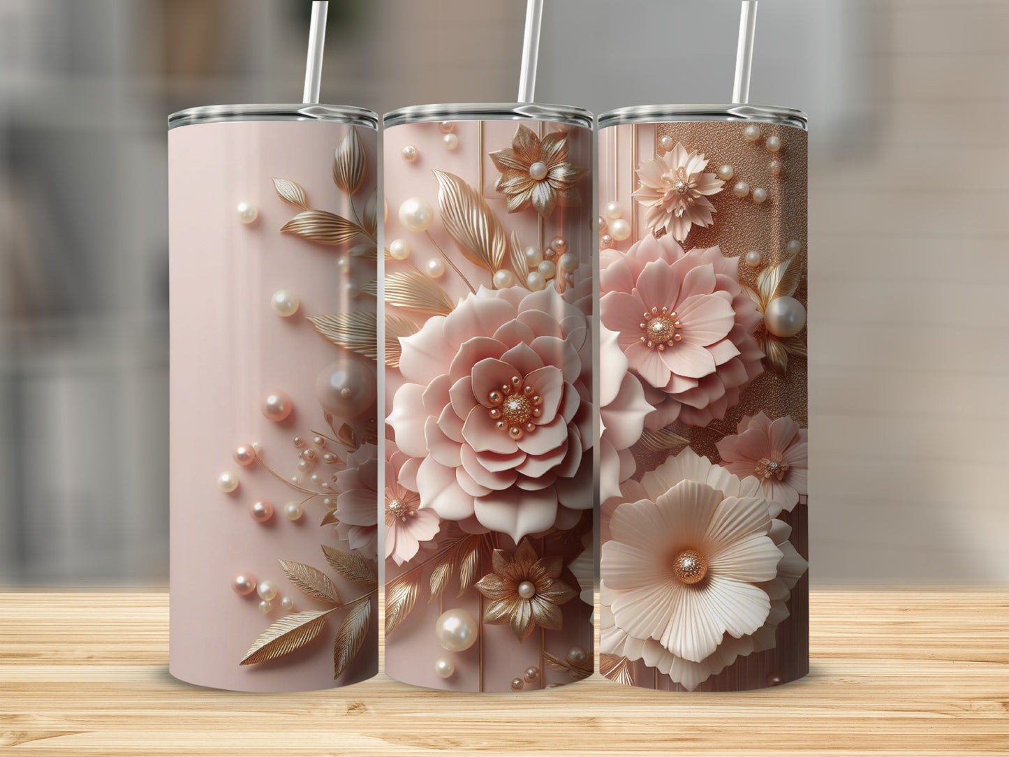 Three pink tumblers adorned with pearl and floral embellishments.