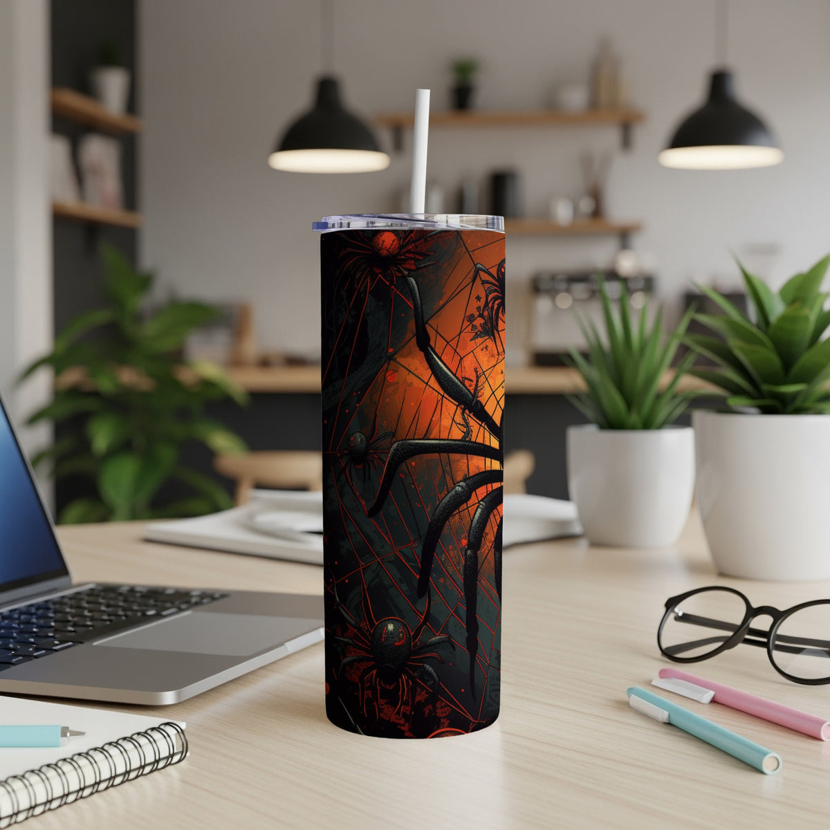 Tall tumbler with a dark Halloween-themed spiderweb and spider design.