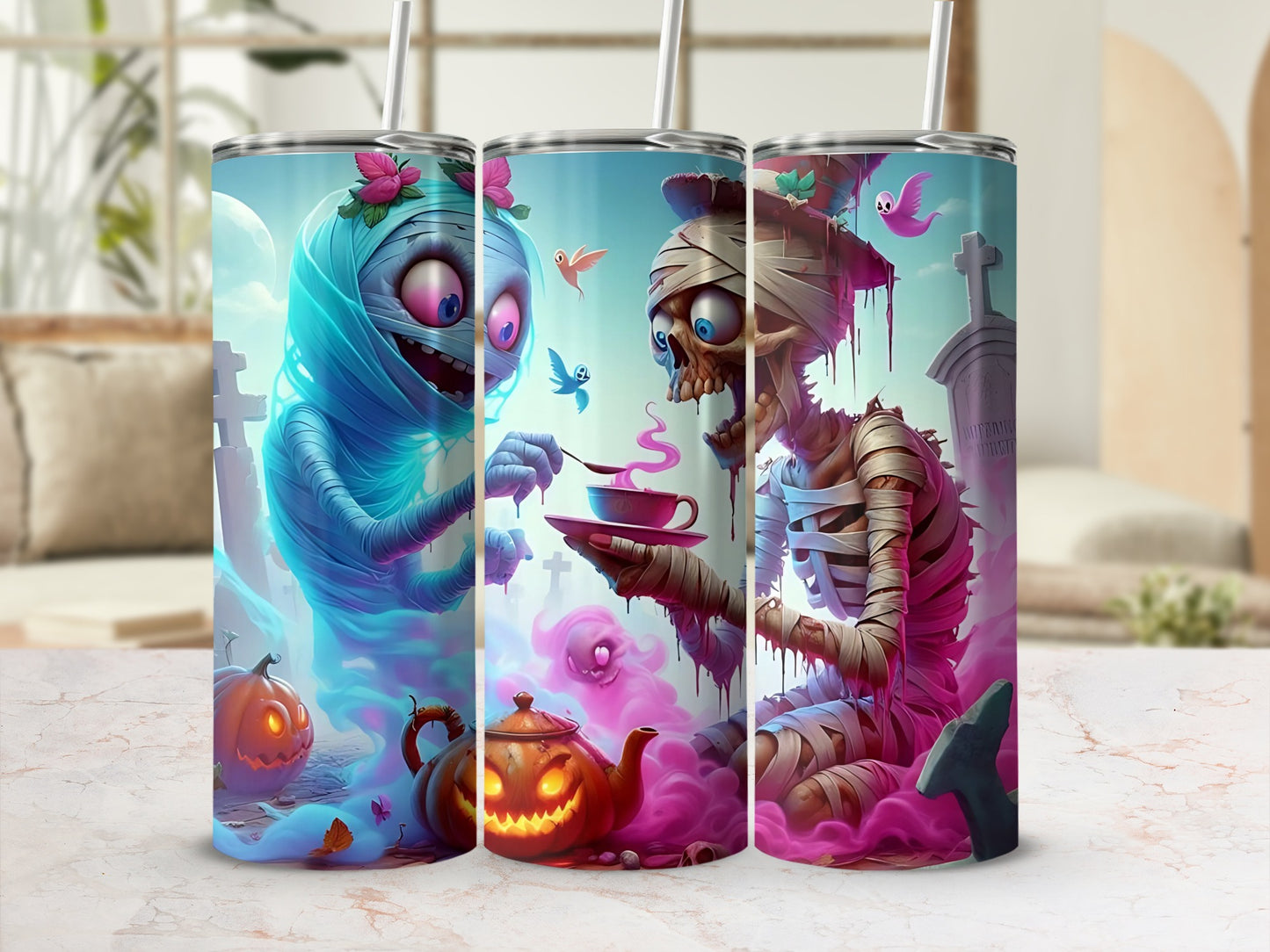 Three tumblers featuring cartoon mummies, a jack-o'-lantern teapot, and spooky Halloween elements.