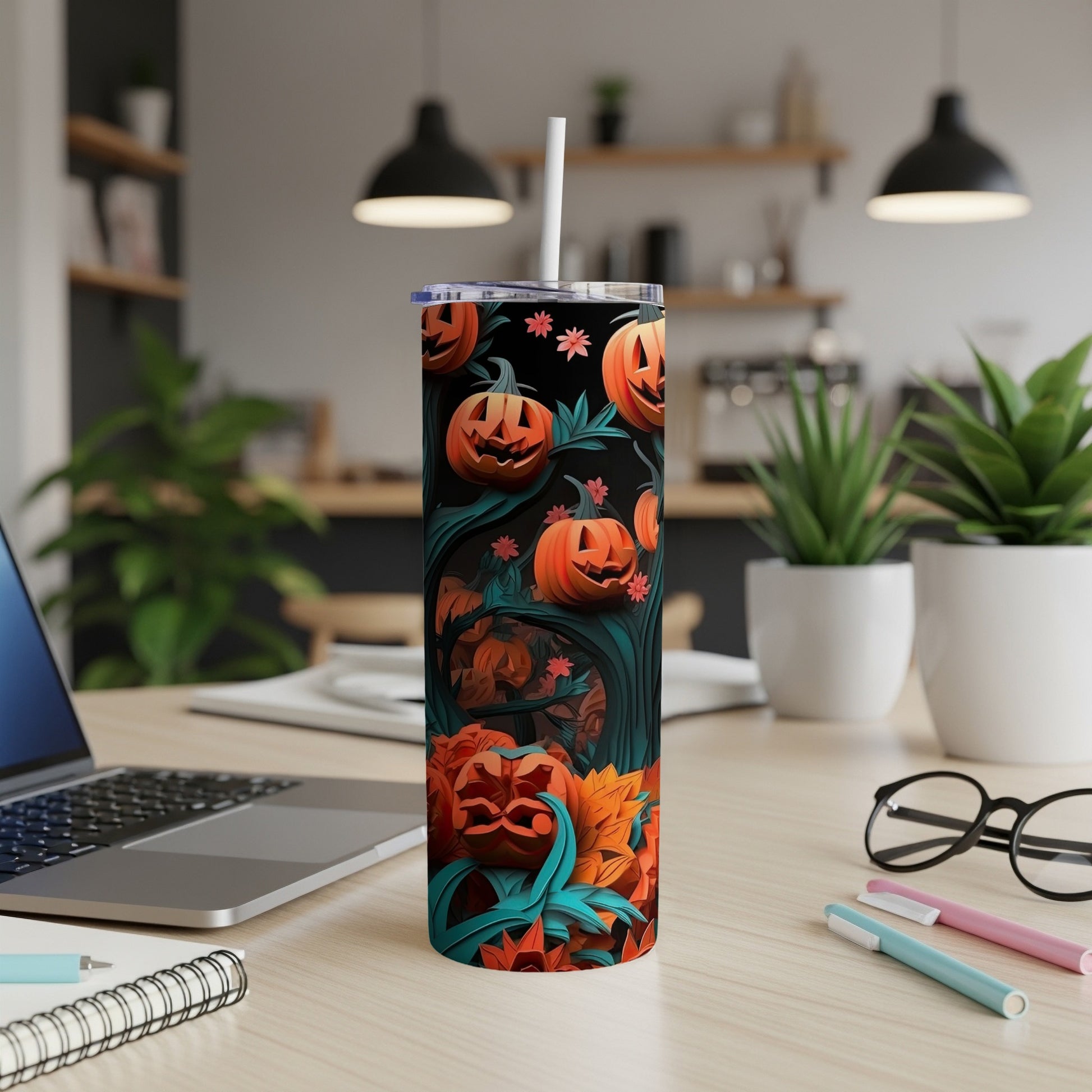 Tumbler with Halloween pumpkin pattern and a straw.