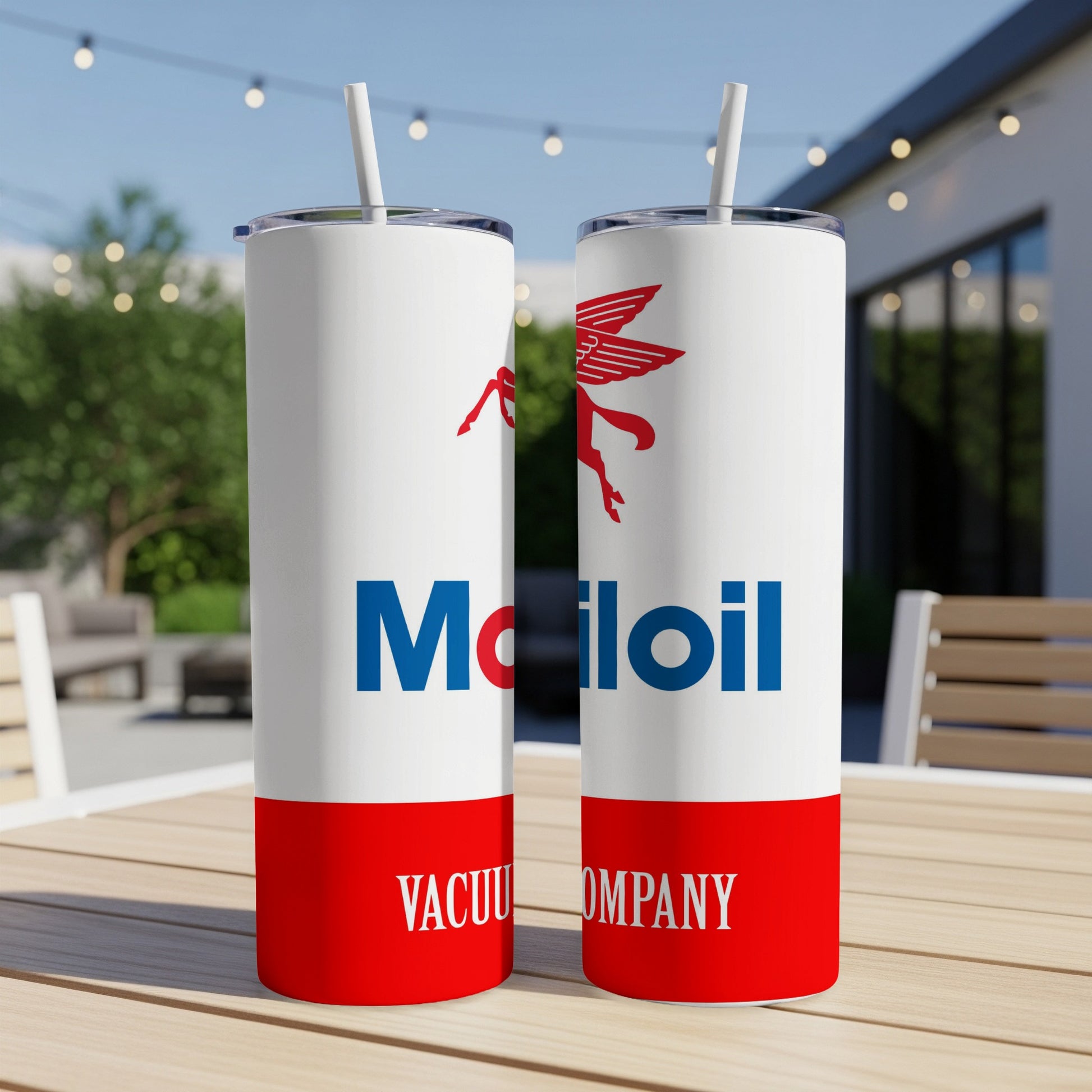 Two Mobil oil company tumblers with red and white branding on a wooden table.