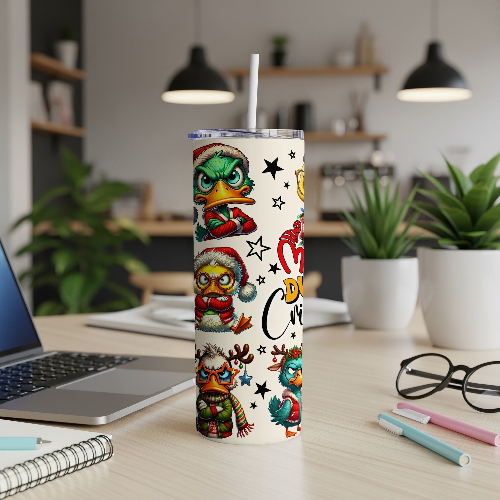 Christmas tumbler with cartoon ducks in festive hats and scarves.