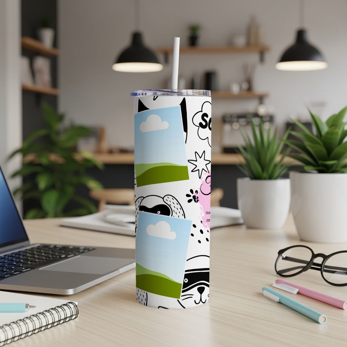 White tumbler with cartoon animal drawings, clouds, and text.
