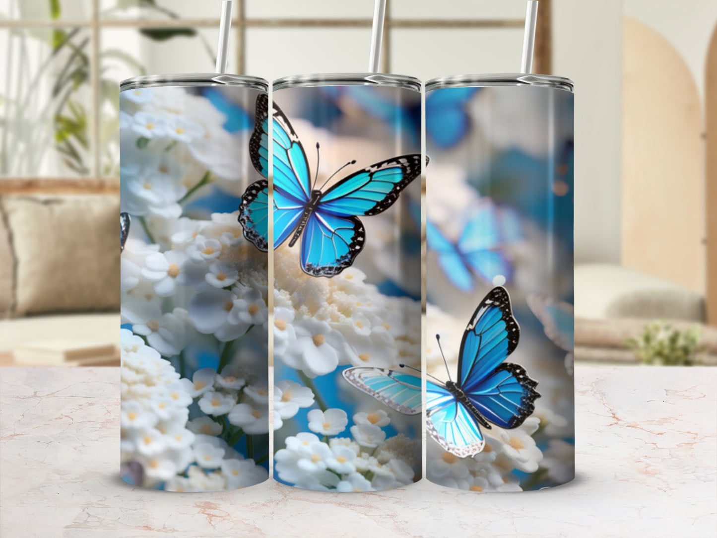 Blue butterflies on white flowers, three tumblers displayed.