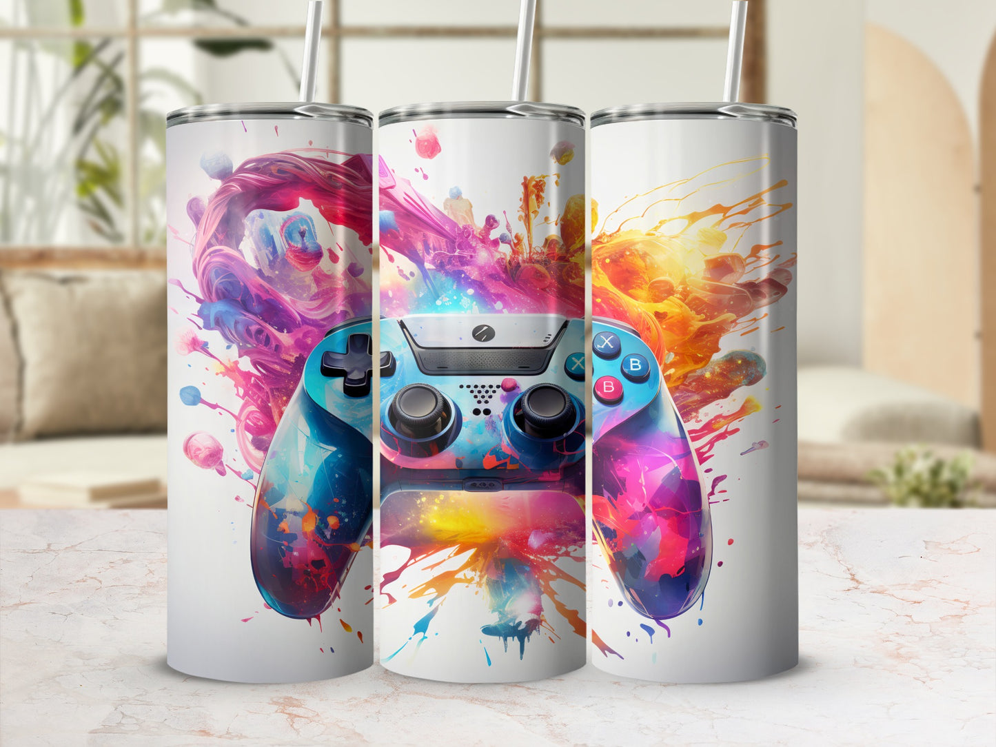 Three tumblers with colorful video game controller and paint splatter design.