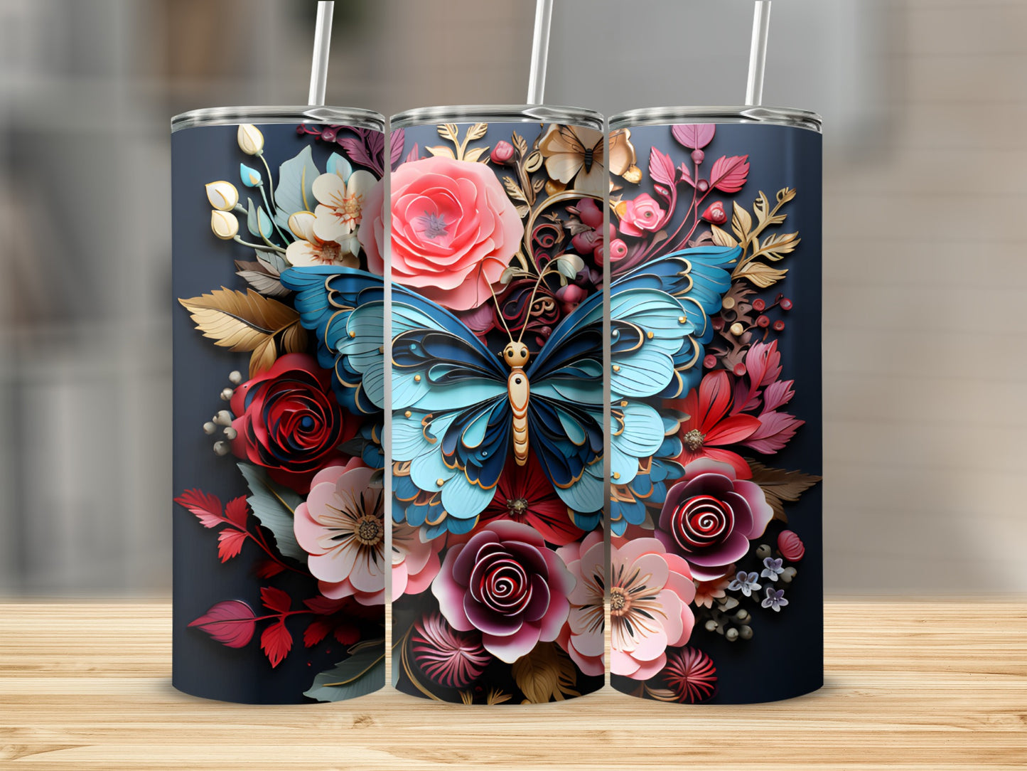 Three tumblers displayed with a blue butterfly and floral design.