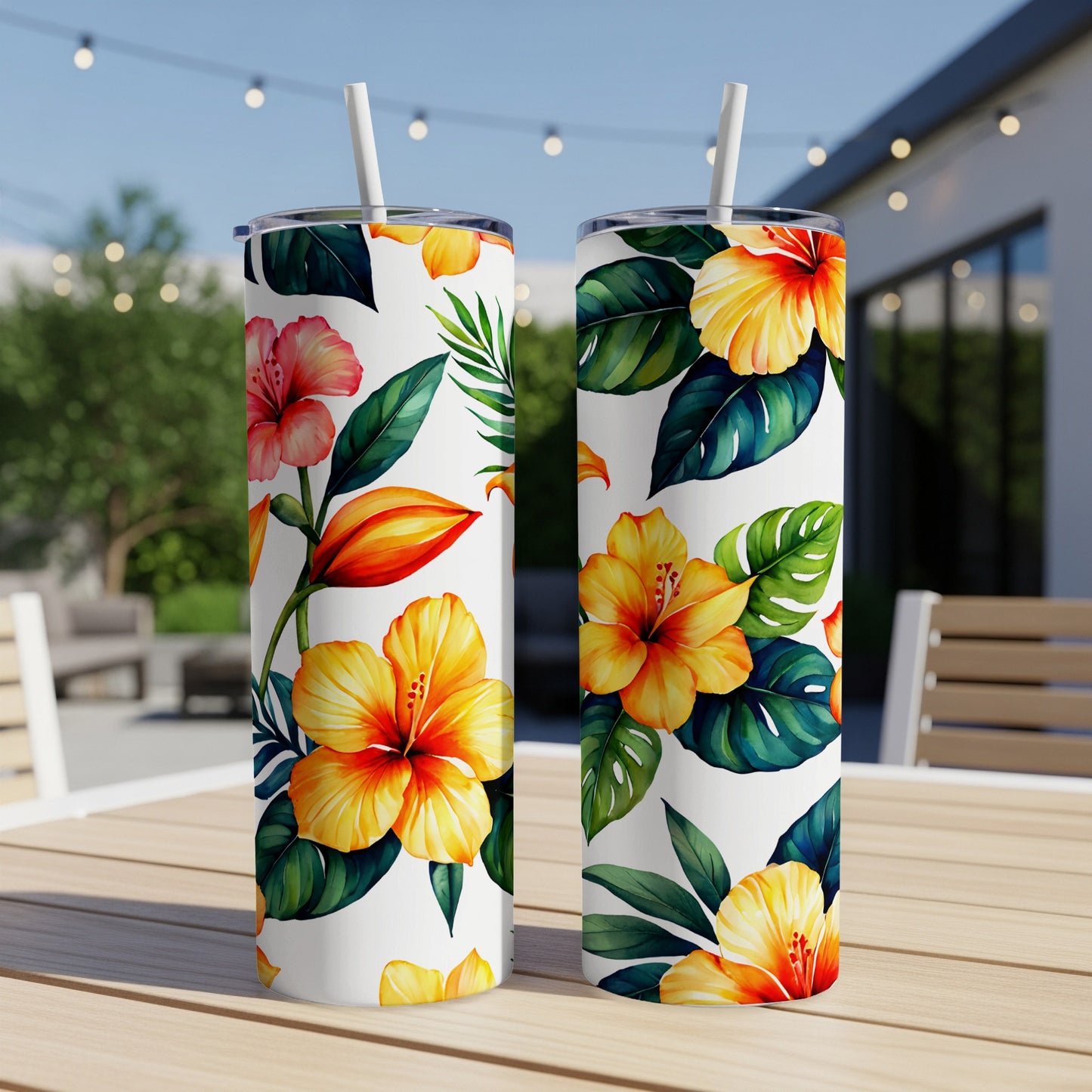 Two tall tumblers with a repeating hibiscus flower and leaf pattern.