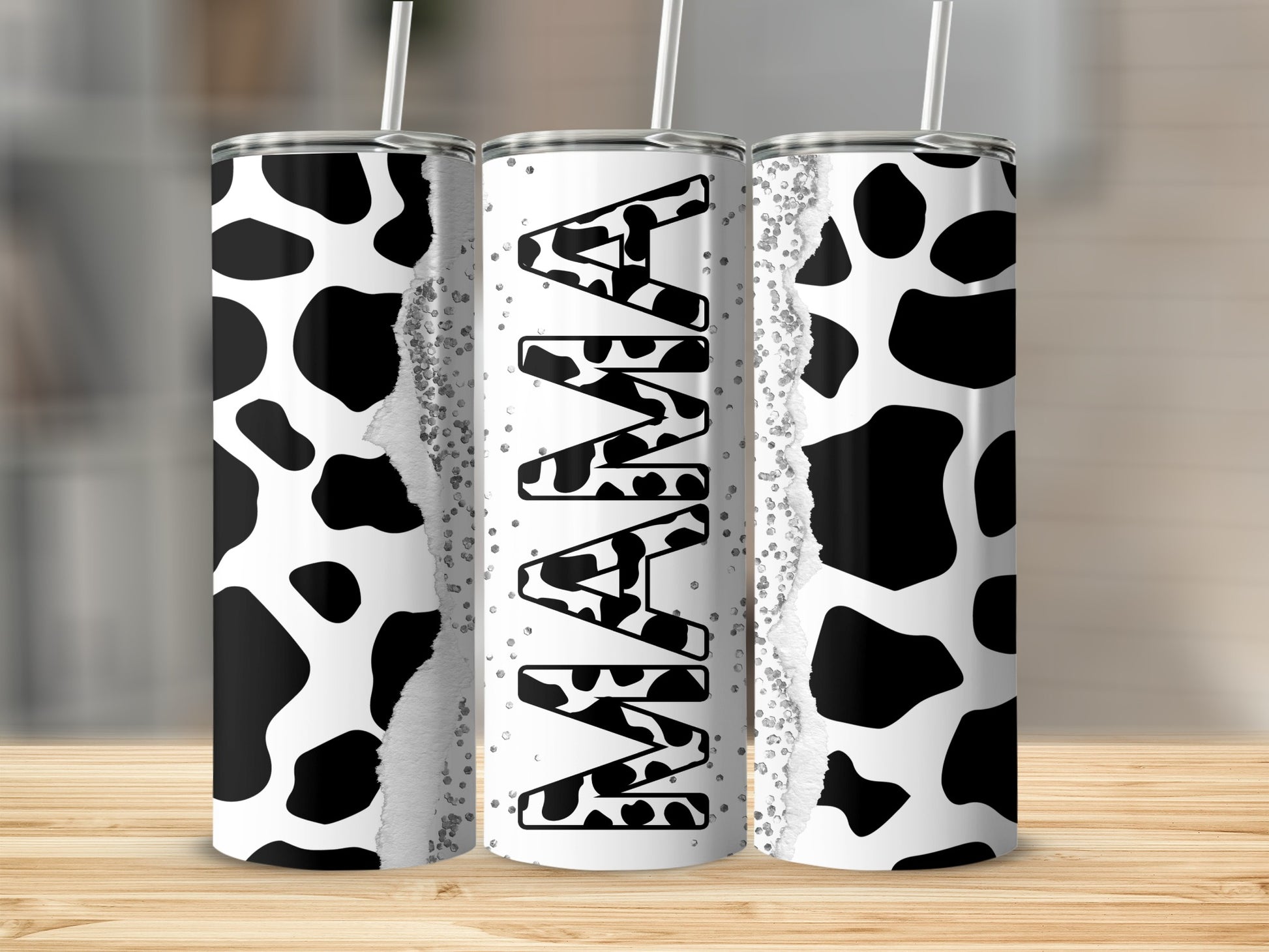 Tumbler with black and white cow print and "Mama" text.