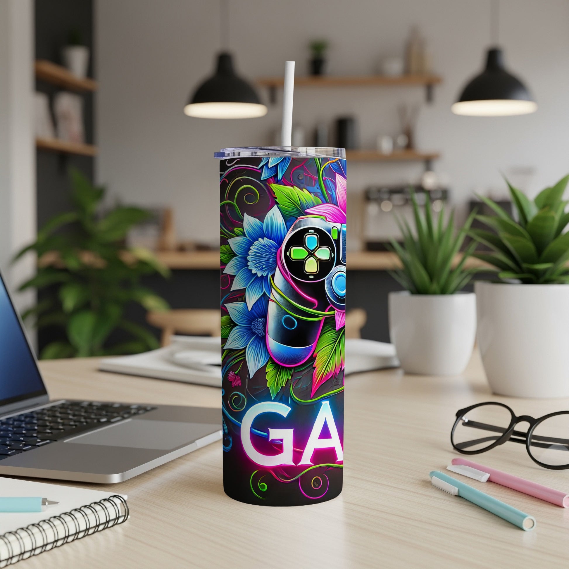 Tumbler with video game controller and floral design.