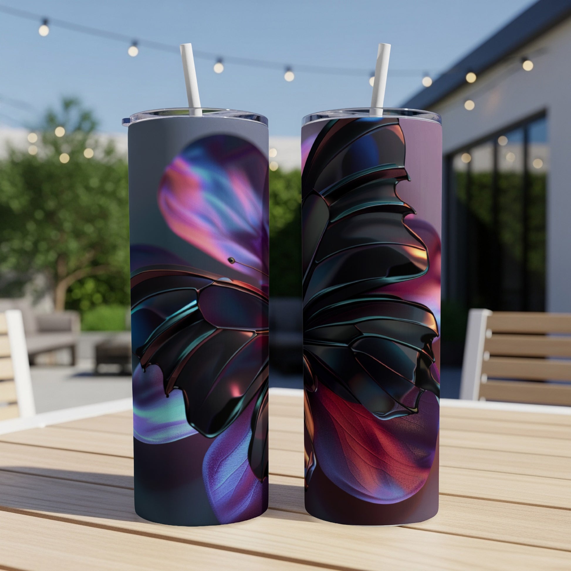 Two tall tumblers featuring a metallic butterfly wing design on an outdoor table.