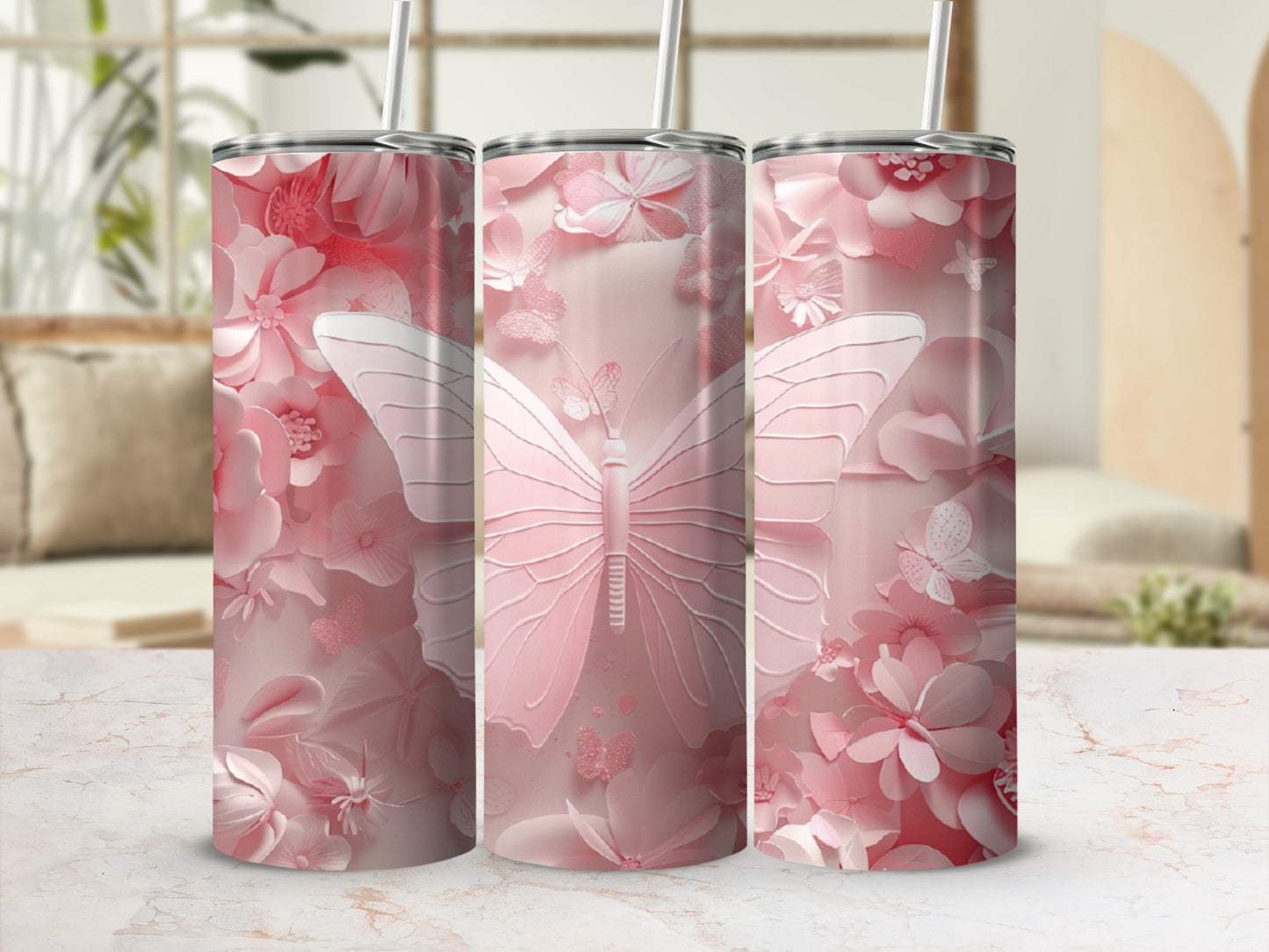 Pink butterfly and floral pattern on three tumblers.