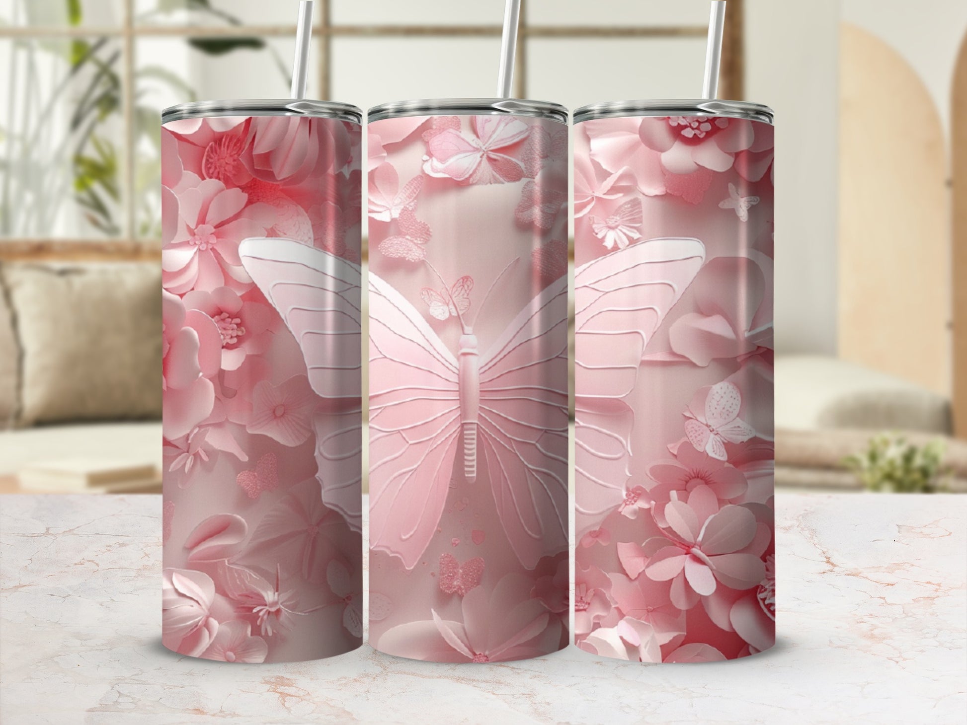 Pink butterfly and floral pattern on three tumblers.