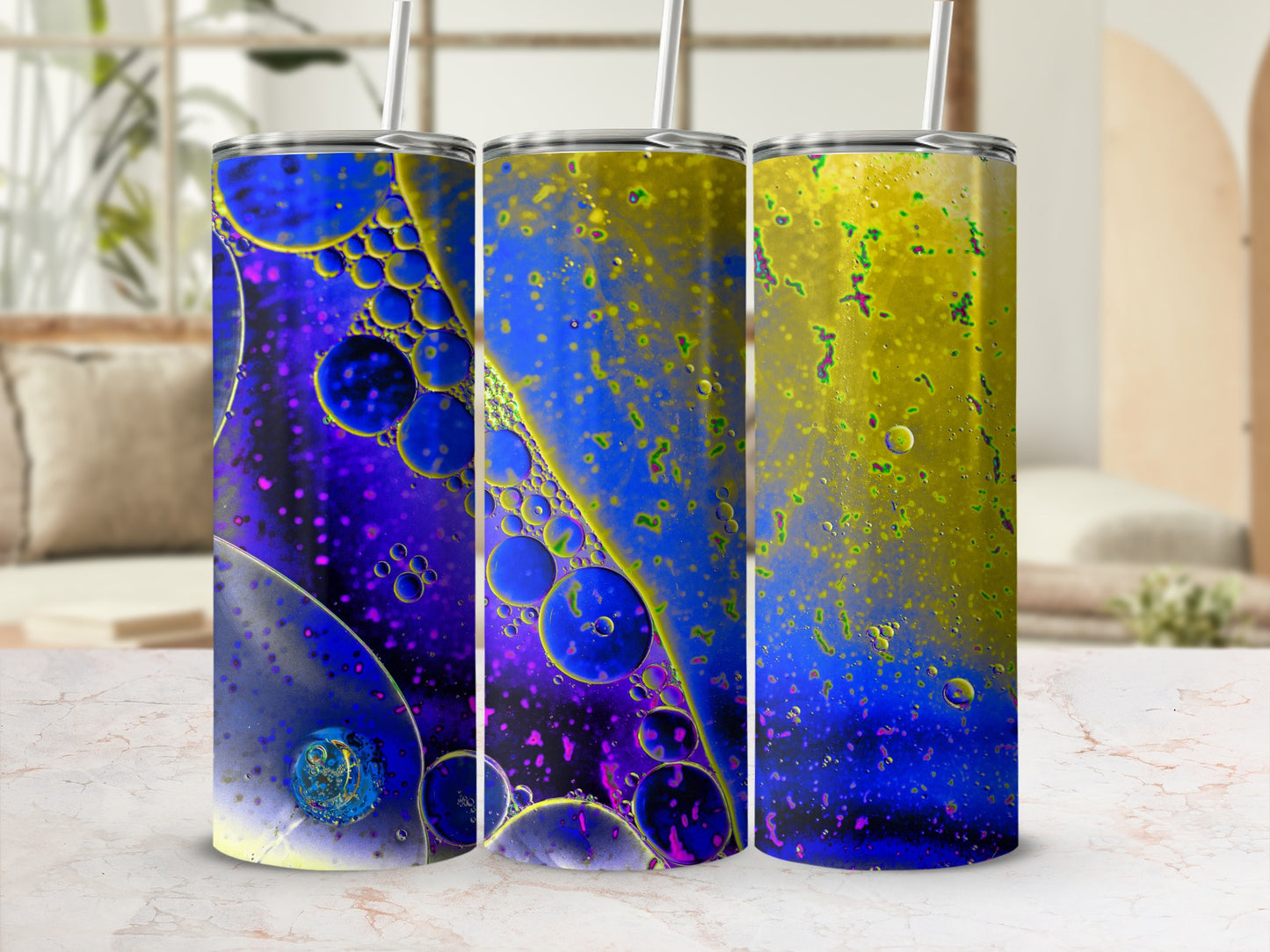 Three tumblers with a swirling abstract pattern of purple and yellow bubbles.