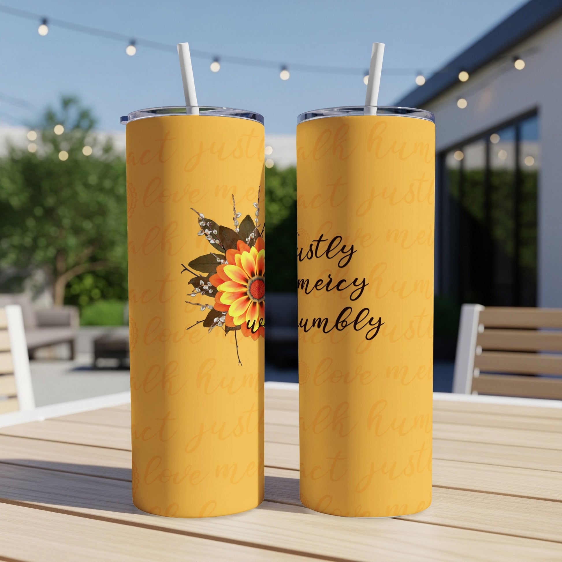 Yellow tumbler with sunflower graphic and "justly mercy humbly" text.