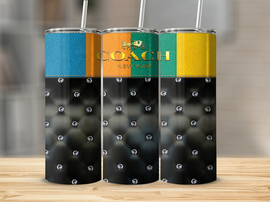 Coach New York tumblers with diamond-tufted black bottoms and colorful patterned tops.