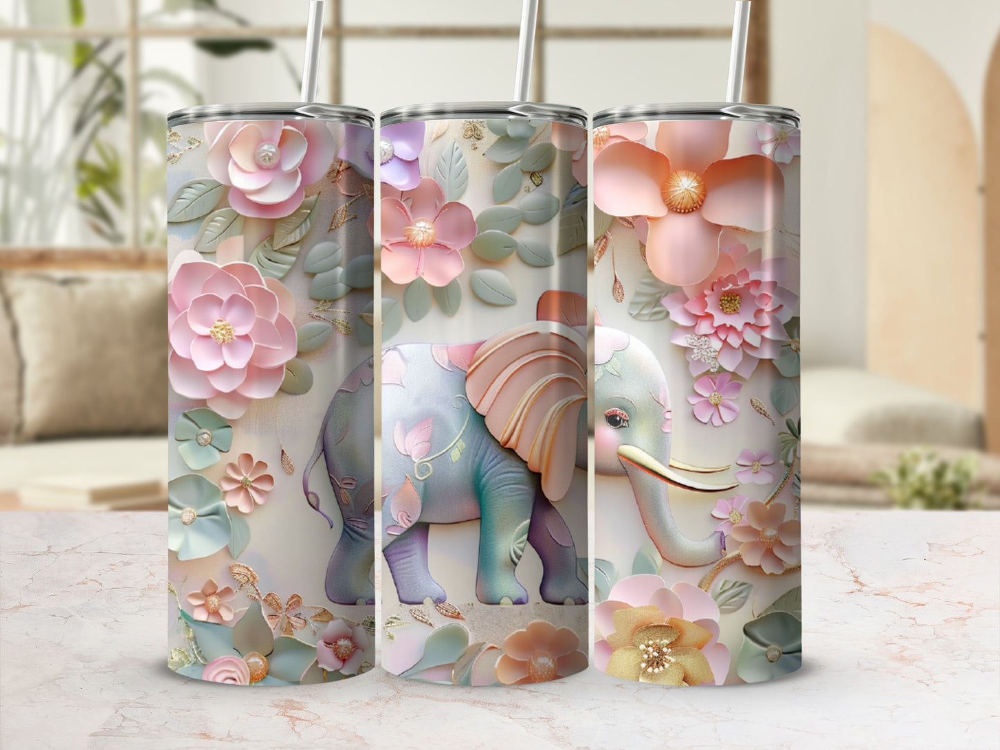 Three tumblers with floral elephant designs and pastel colors.