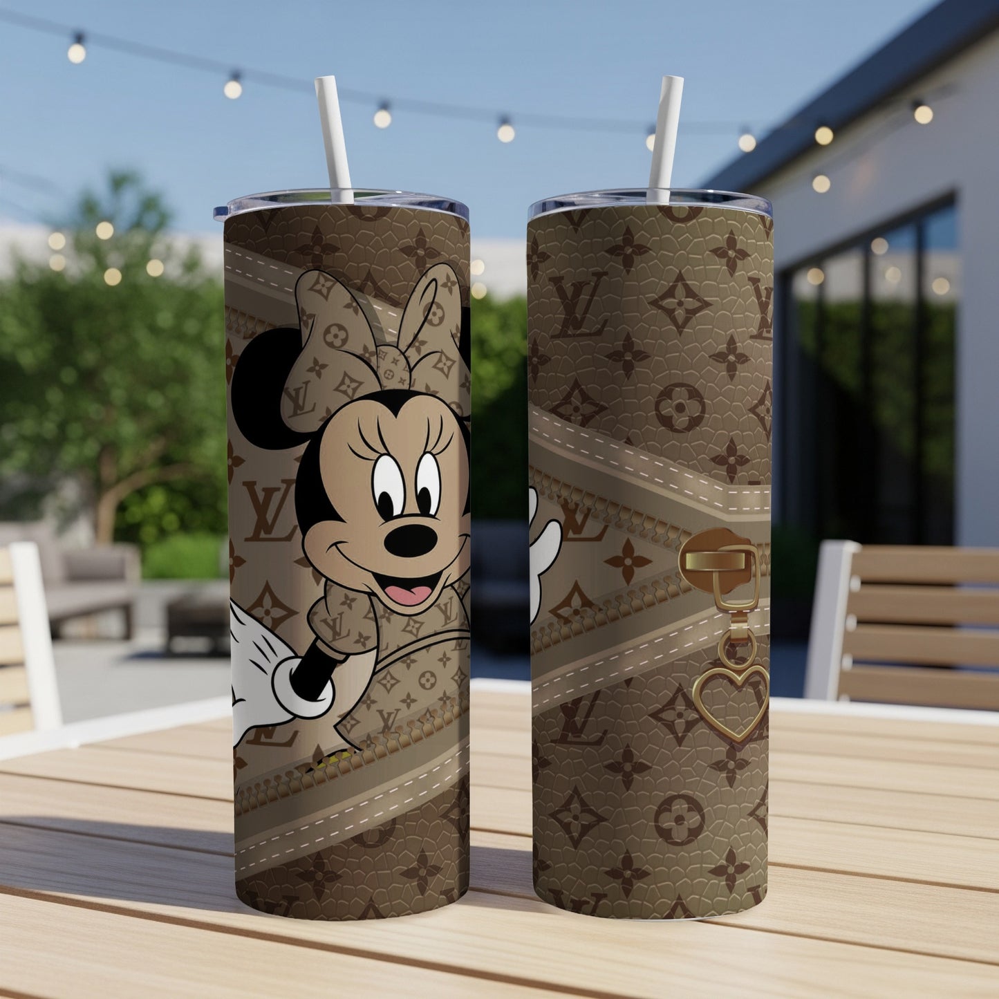 Minnie Mouse on a brown tumbler with a Louis Vuitton-inspired pattern and gold hardware.