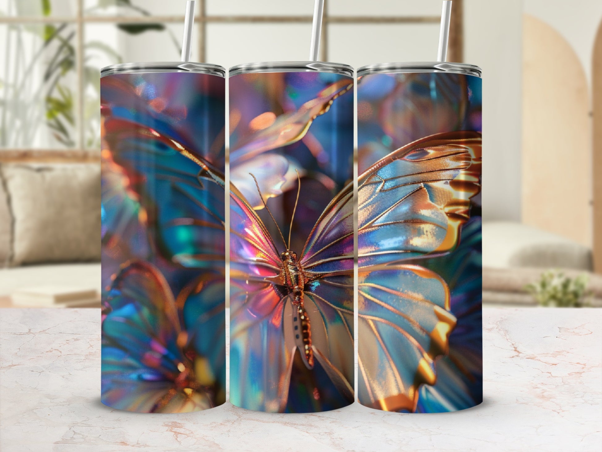 Three tumblers with iridescent butterfly wings design, displayed on a marble surface.