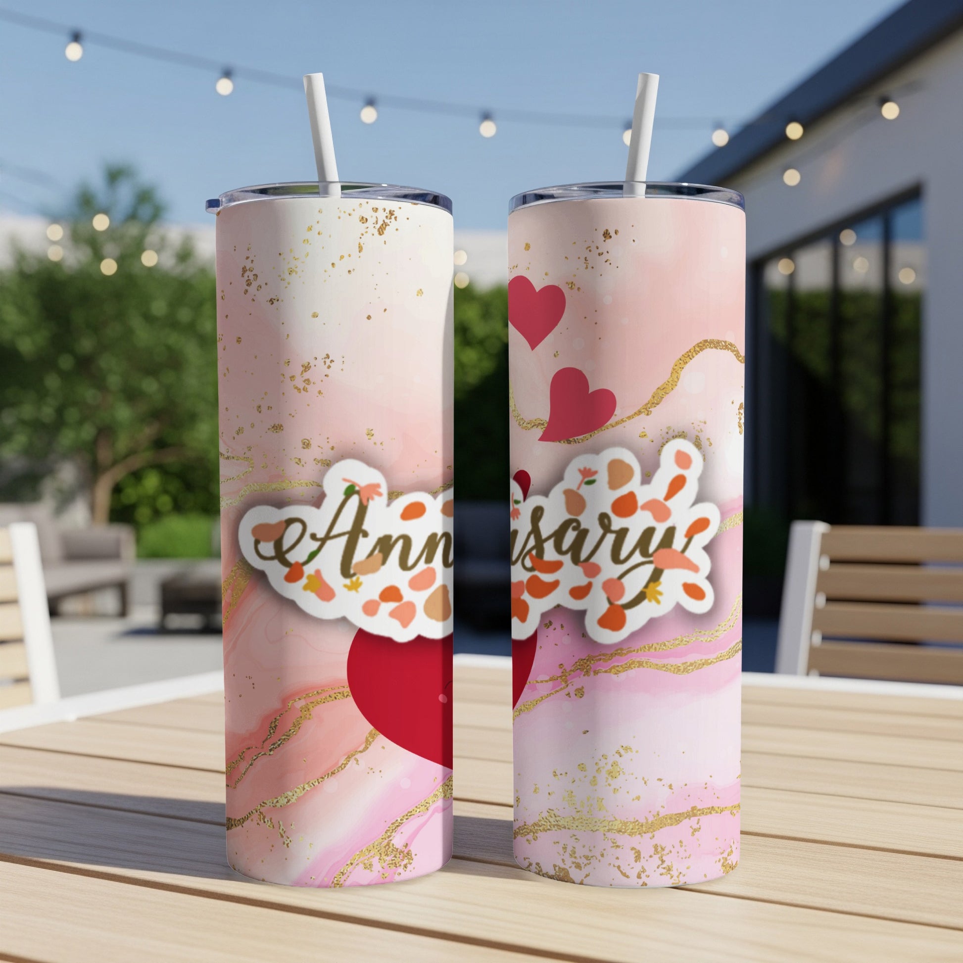 Anniversary tumbler with pink marble, hearts, and gold accents.