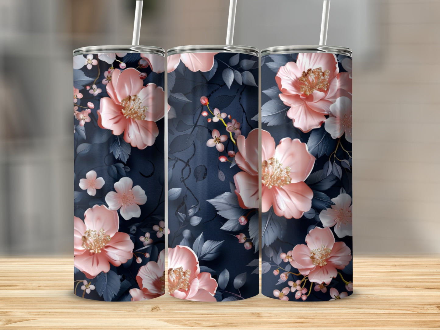 Three tumblers with a dark blue floral pattern featuring pink and white flowers.