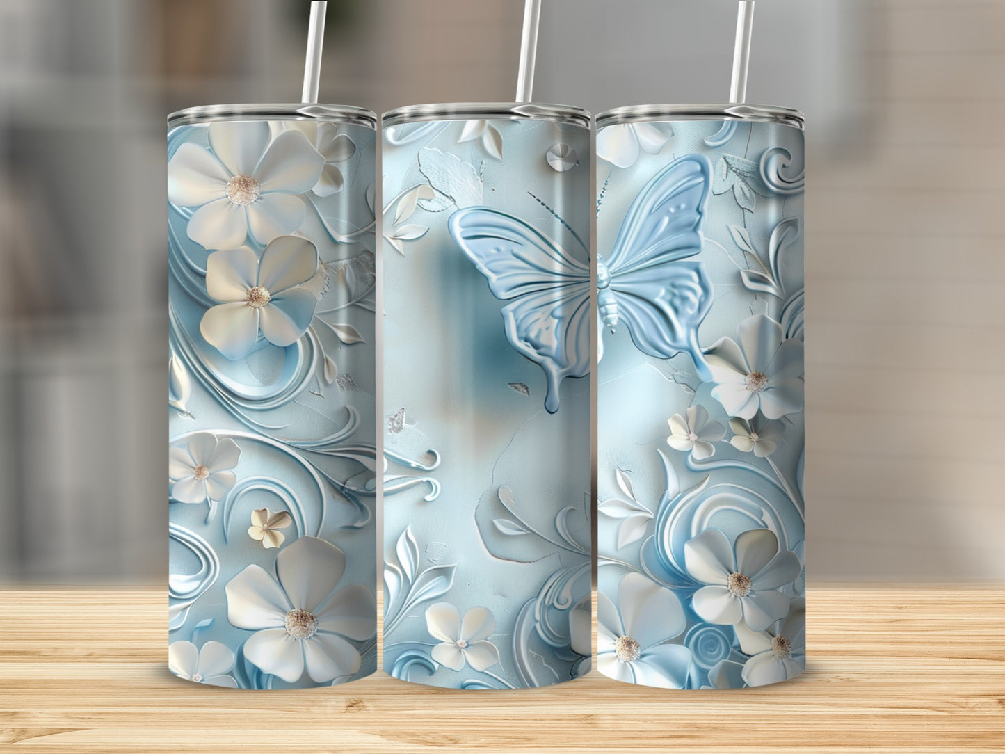 Blue tumbler with butterfly and floral embossed design.