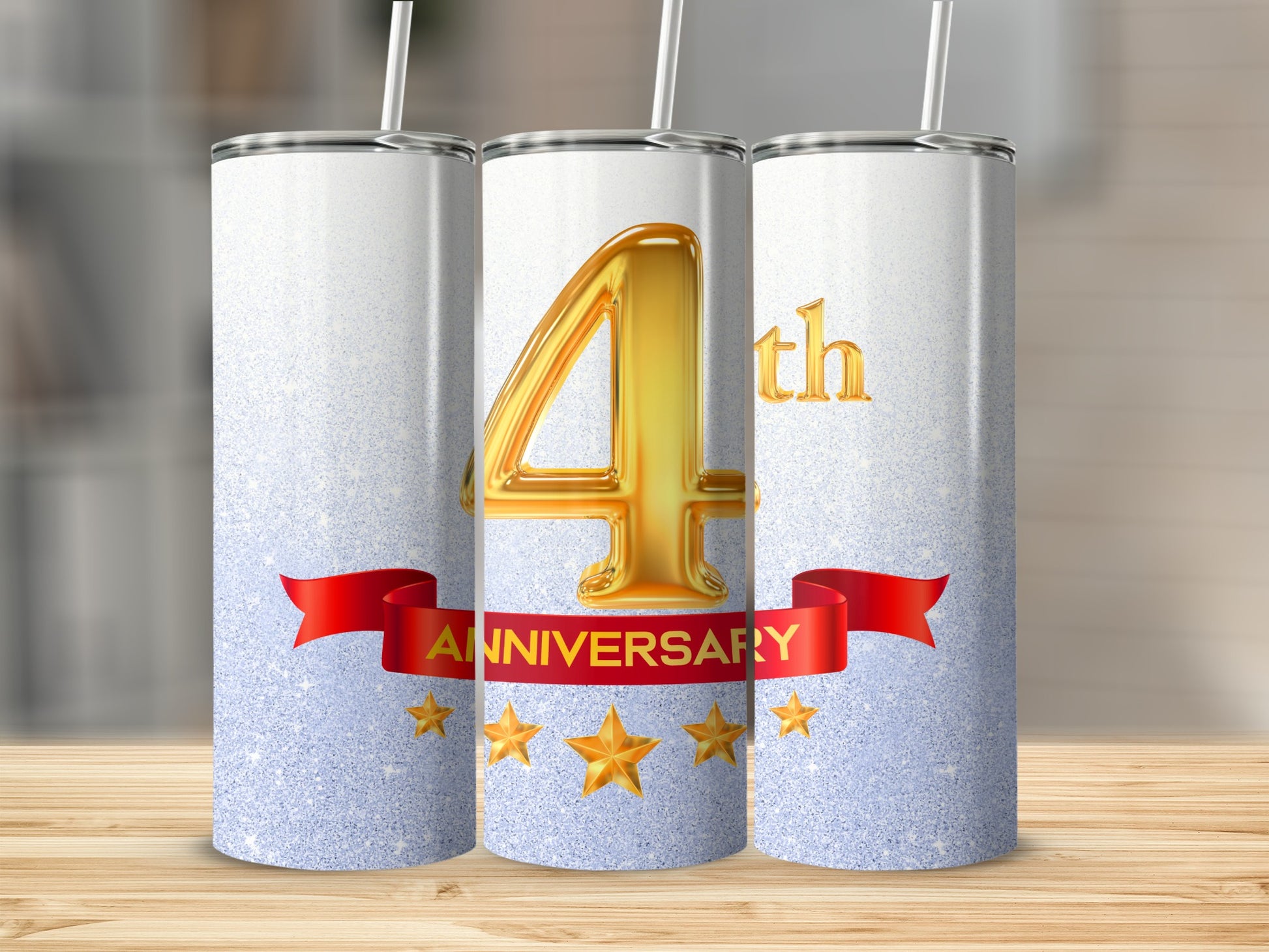 Gold "4th Anniversary" text on glittery tumblers with red ribbon and stars.