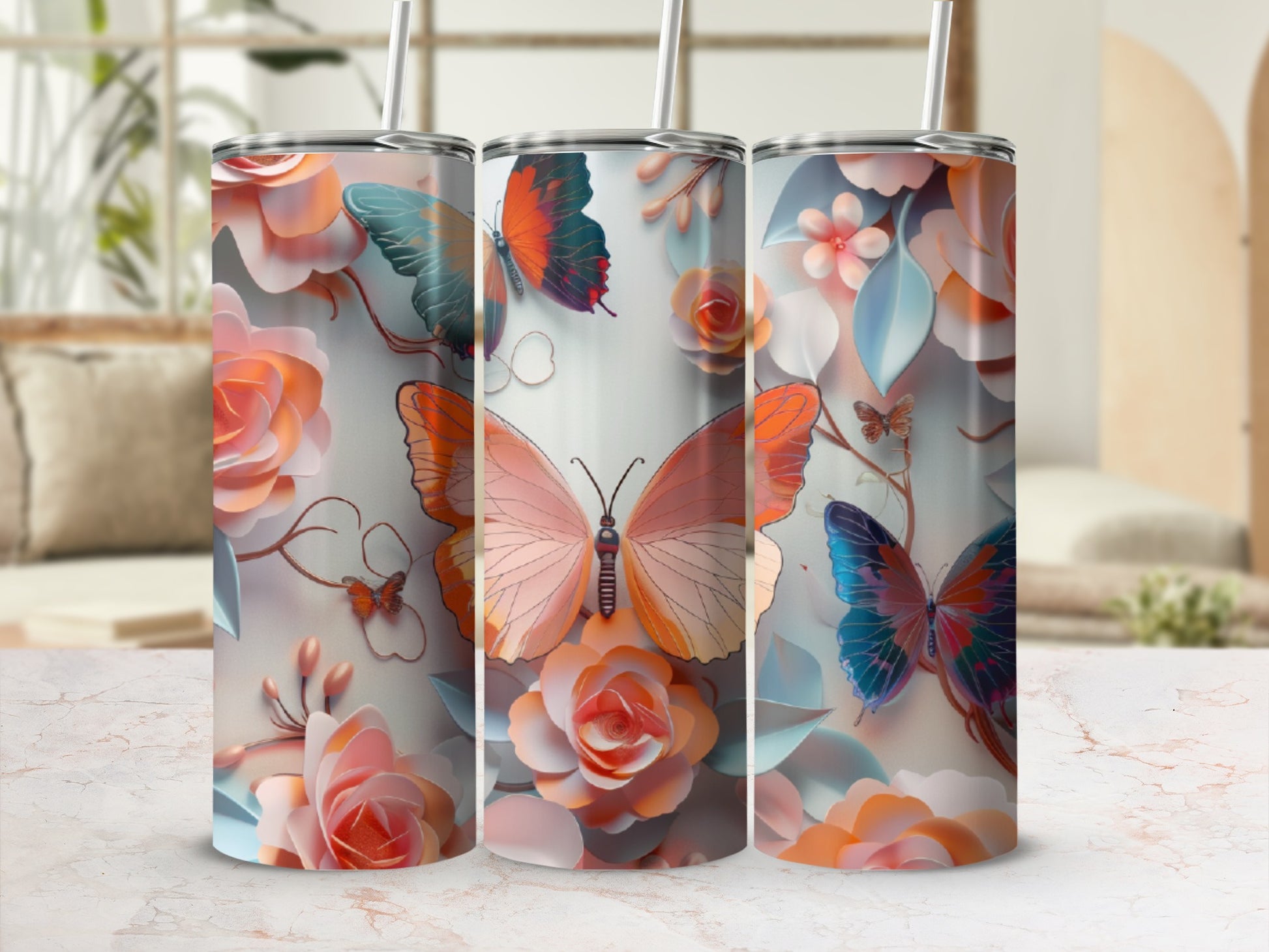 Three tumblers with floral and butterfly designs, featuring a large pink butterfly.