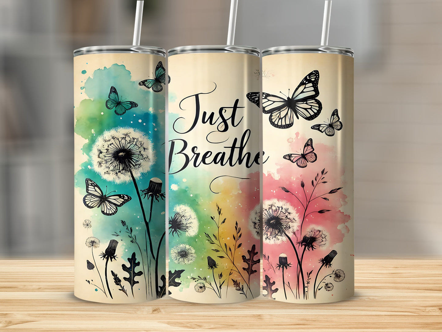 Three tumblers with dandelion and butterfly design, "Just Breathe" text.