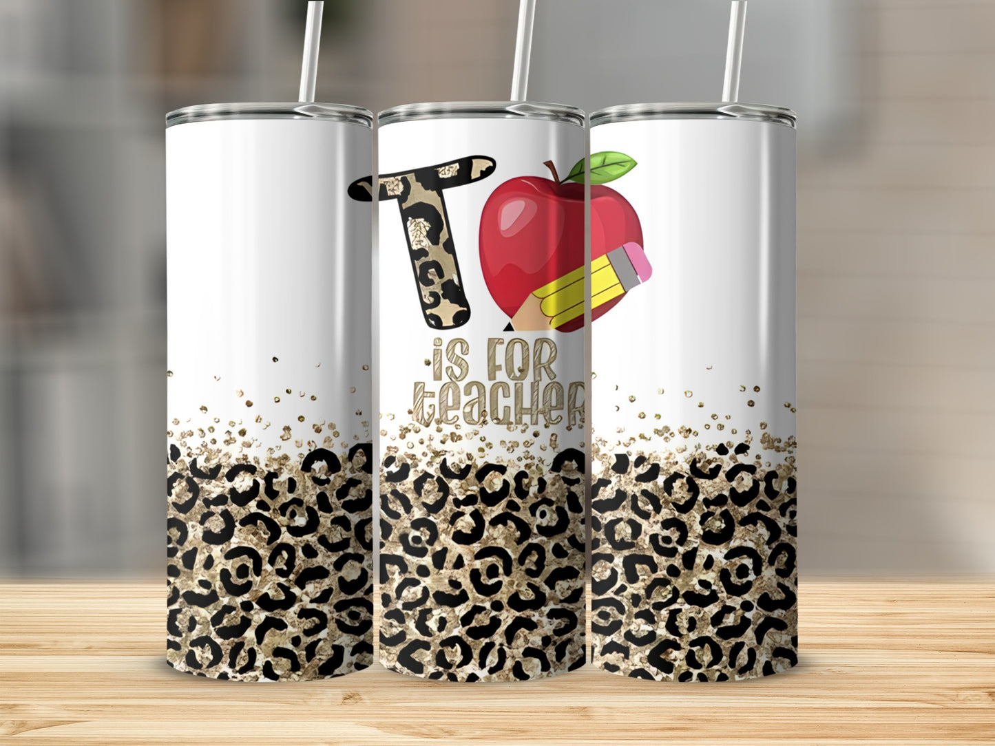 Teacher's tumbler with "T is for Teacher" and apple graphic.