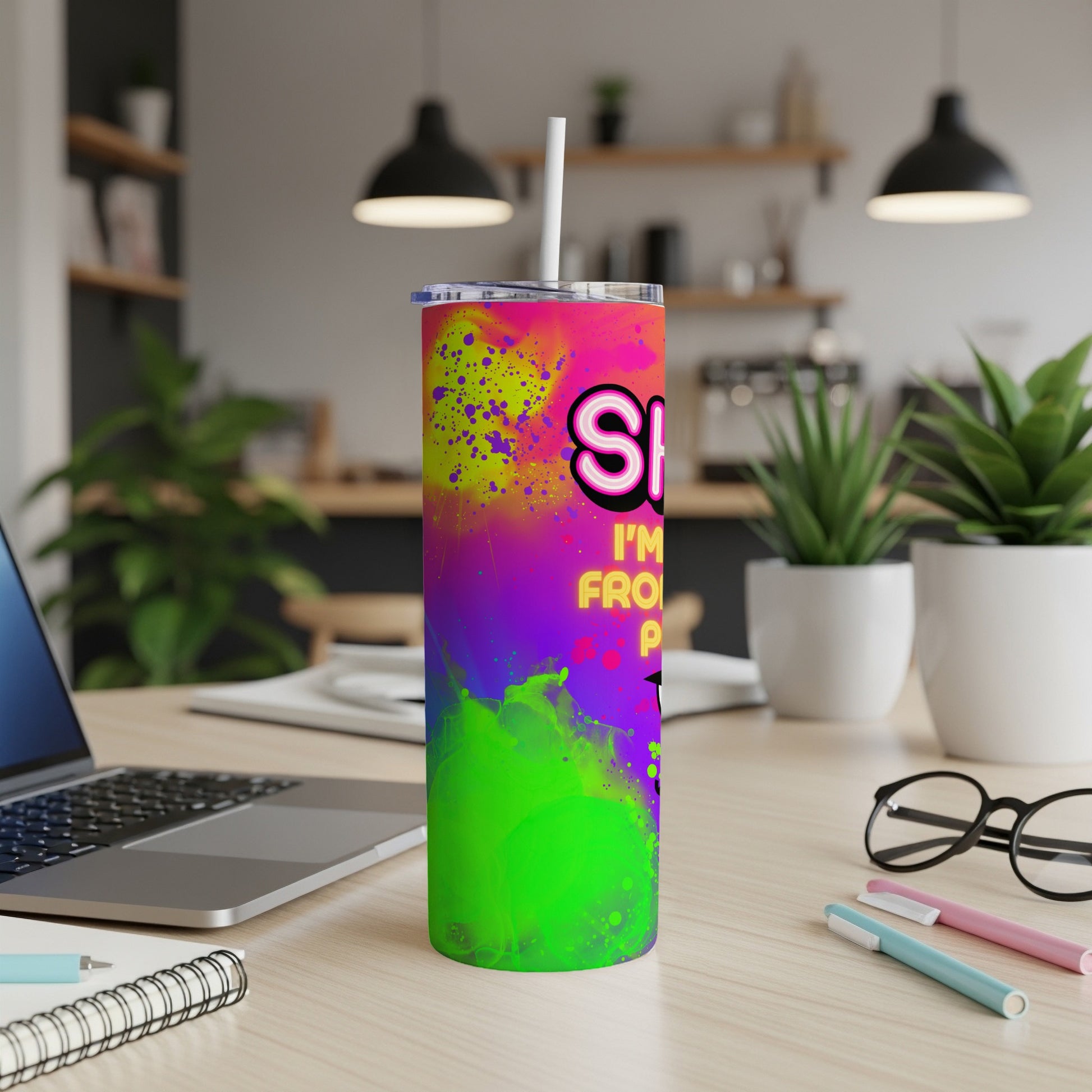 Colorful tumbler with "Shhh I'm from Pittsburgh" text on a desk.