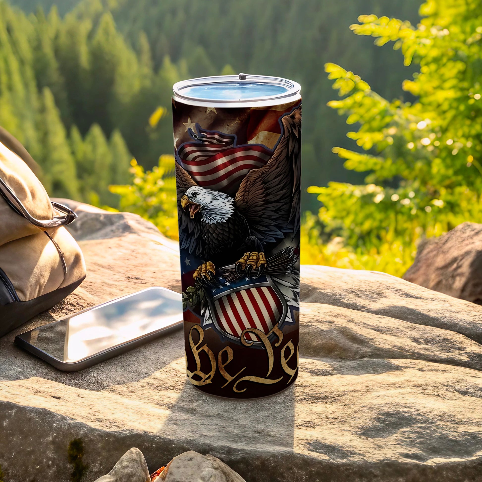 Eagle holding shield with American flag and "Be Ye" text on a tumbler.
