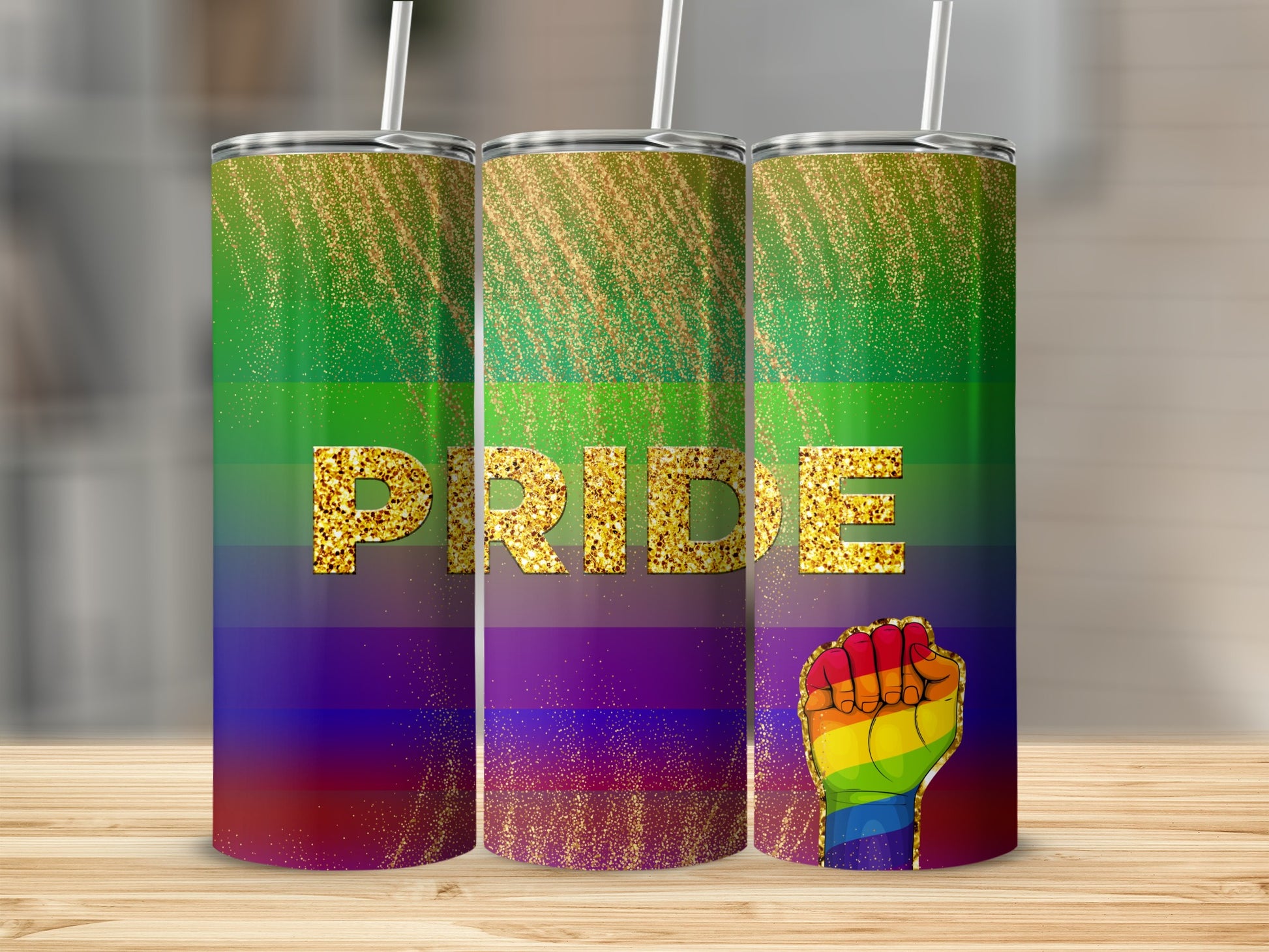 Pride tumbler with rainbow stripes and a raised fist graphic.