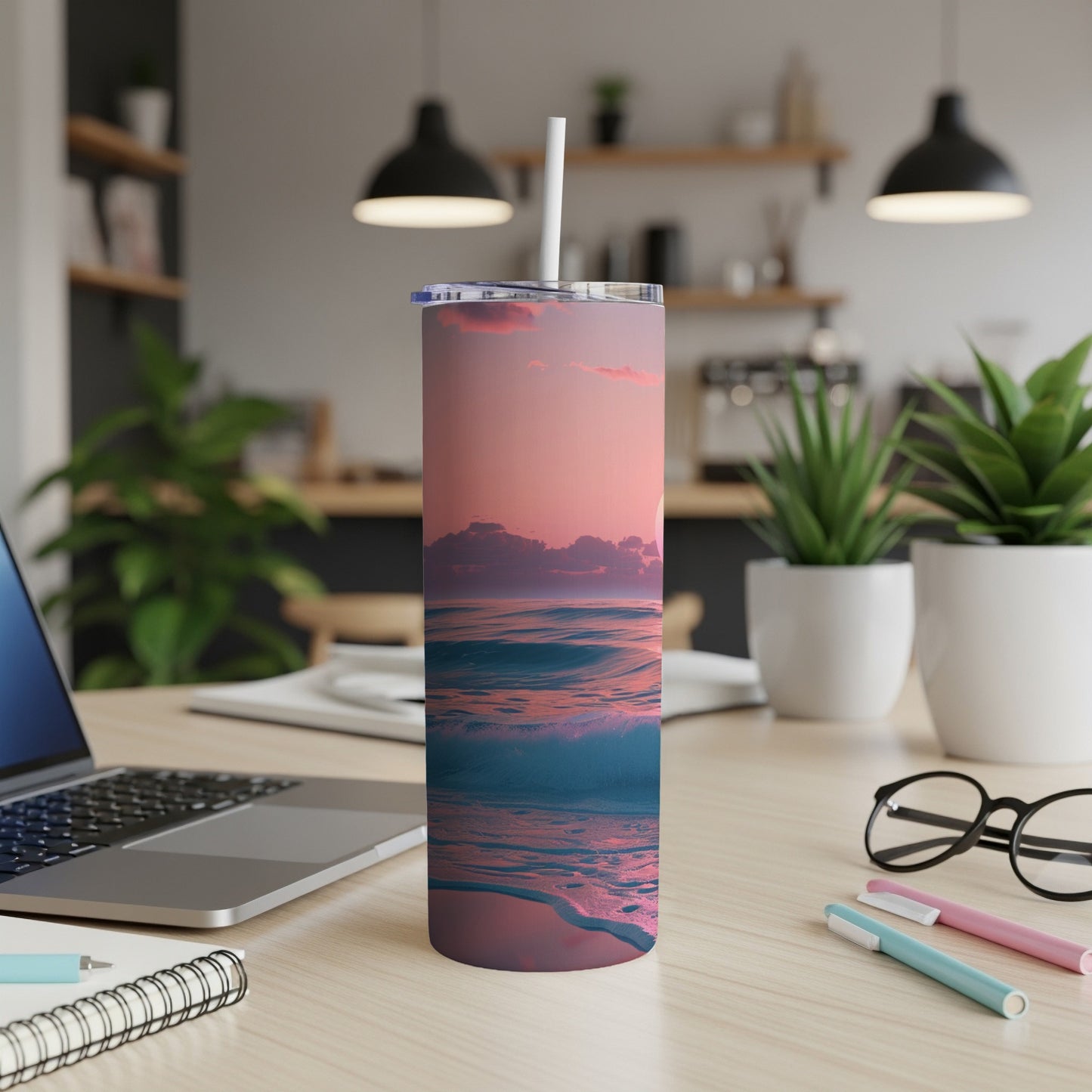 Ocean sunset waves on a tumbler with a straw.
