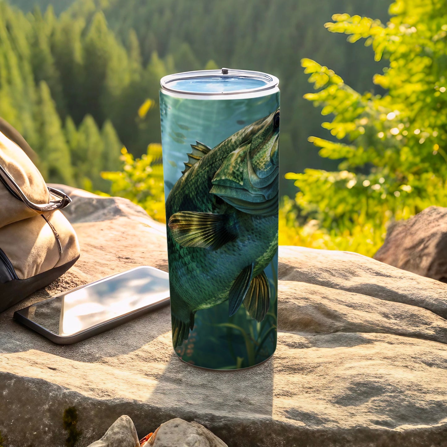 Largemouth bass in water on a tumbler with phone and bag.