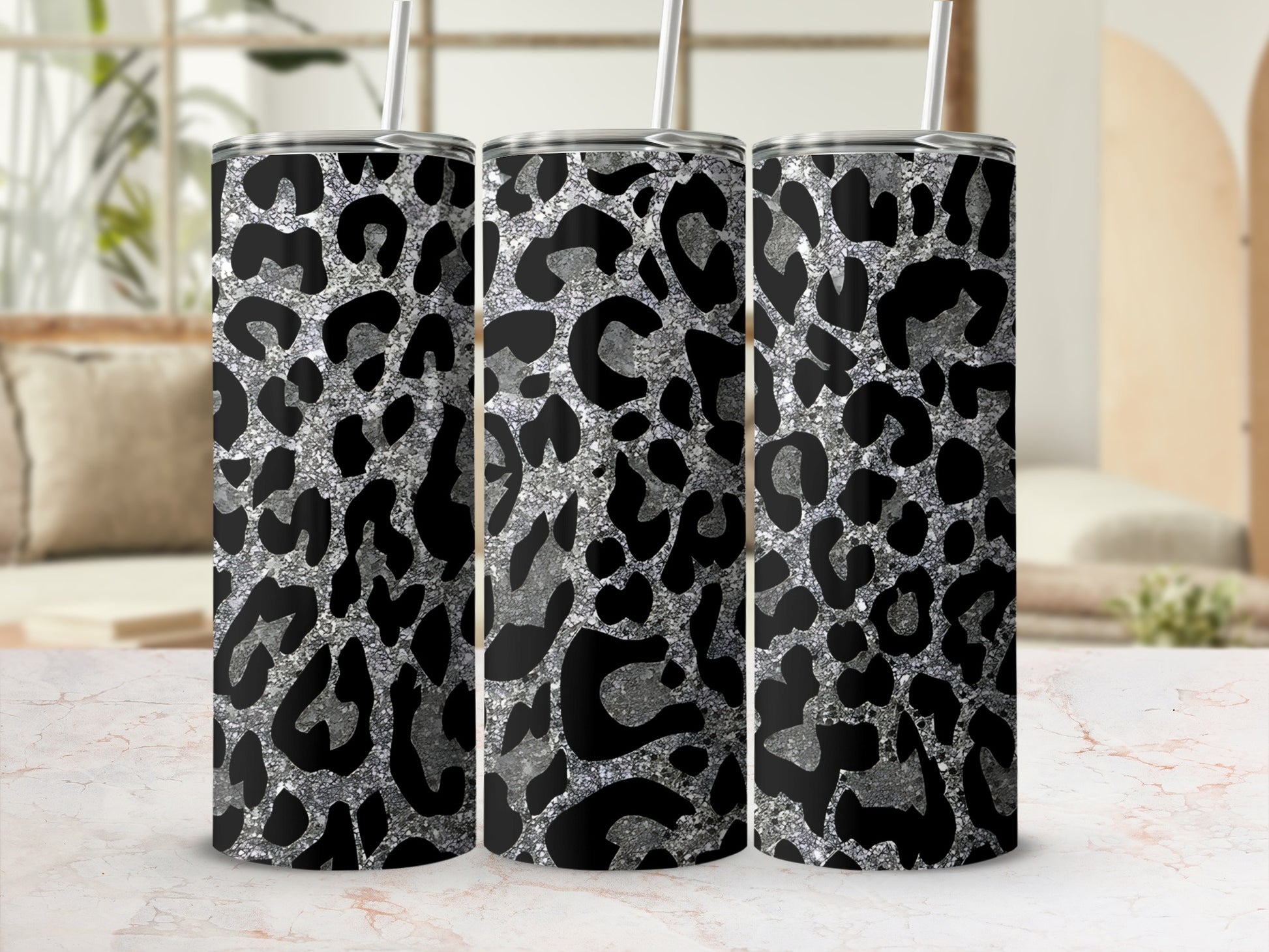 Three tumblers with black and silver leopard print pattern.