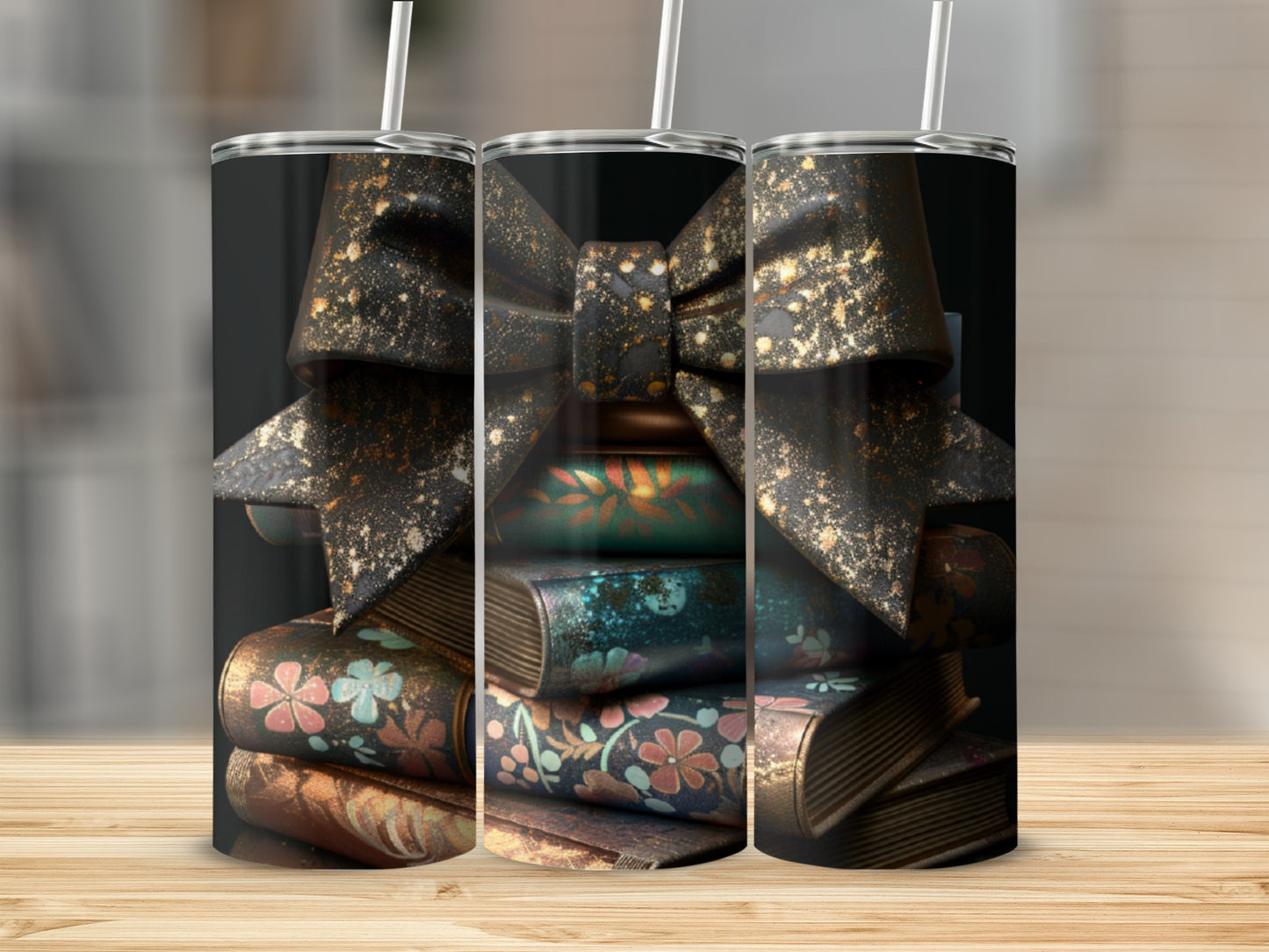 Three tumblers with a black bow and gold glitter over stacked antique books.