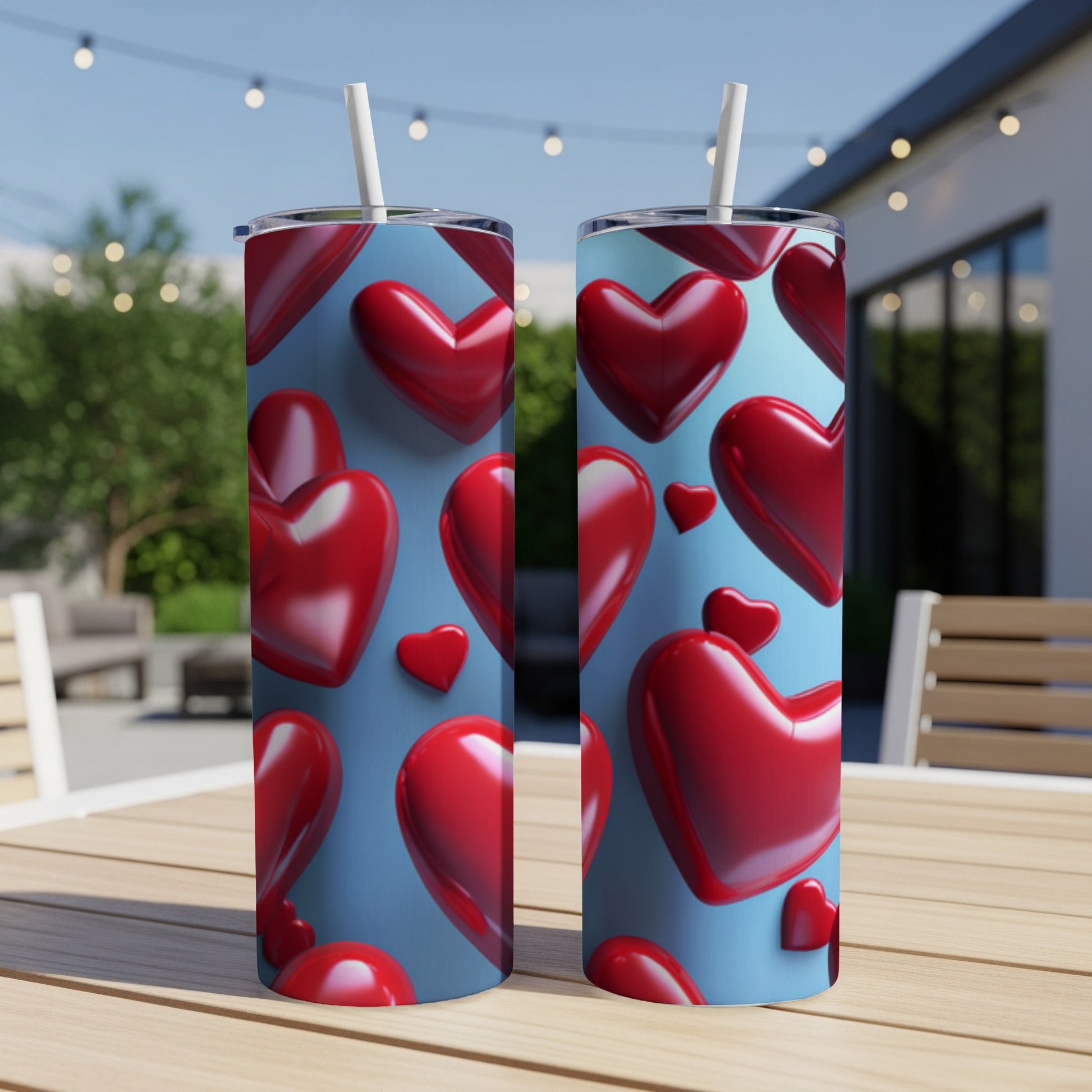 Two tumblers with a repeating pattern of red 3D hearts on a blue background.