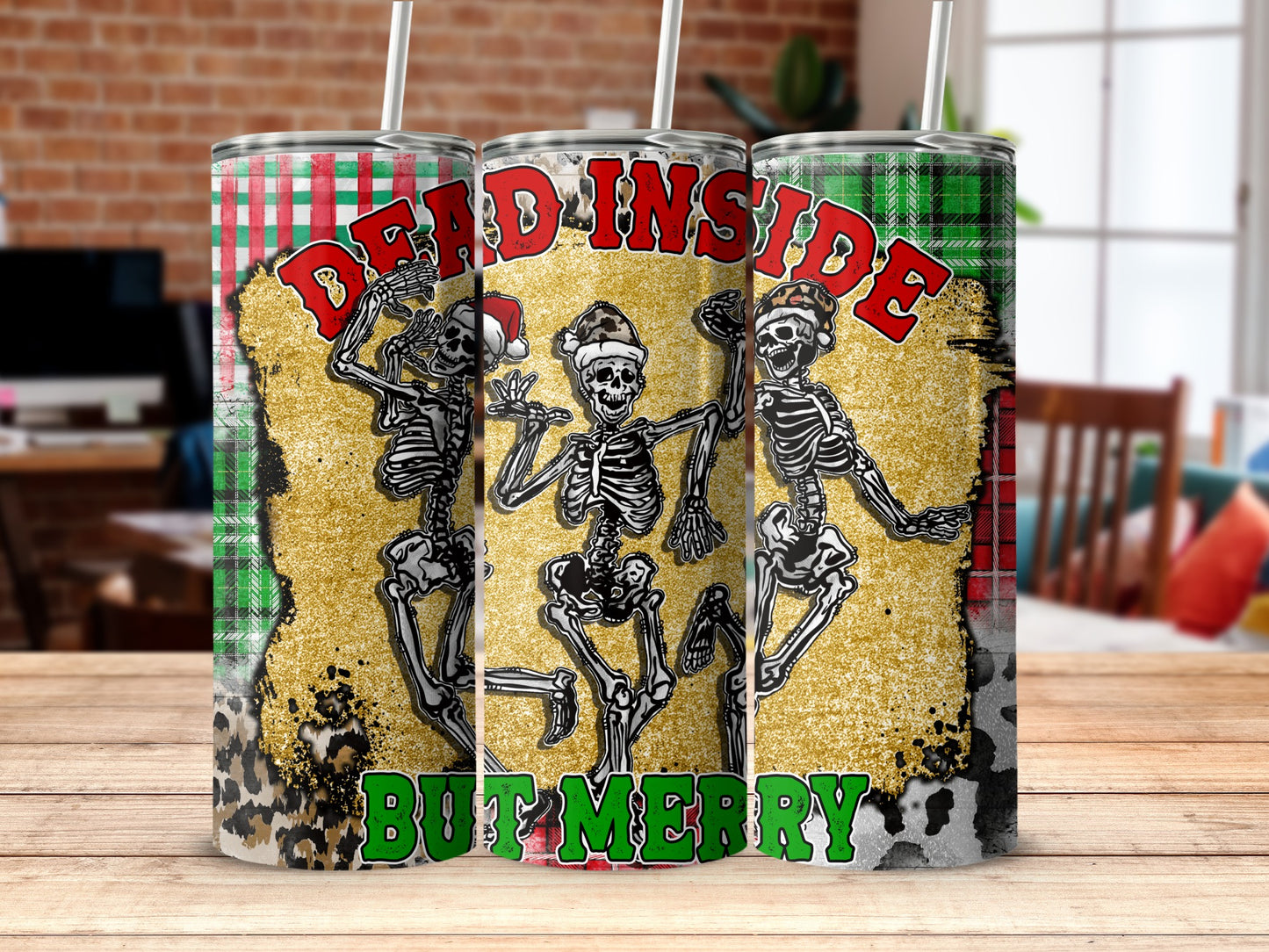 Skeletons in Santa hats saying "DEAD INSIDE BUT MERRY" on a tumbler.