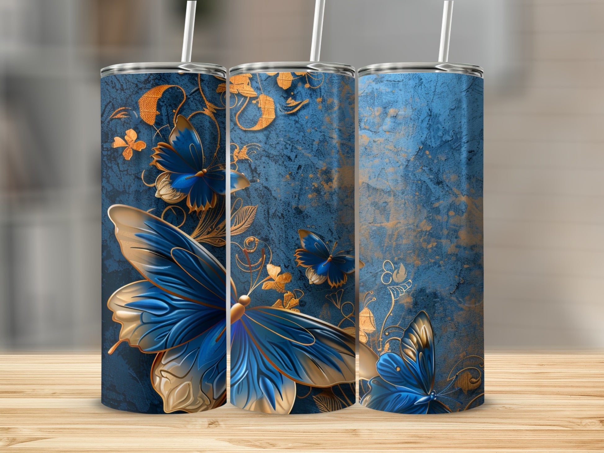 Blue and gold patterned tumblers with butterflies.
