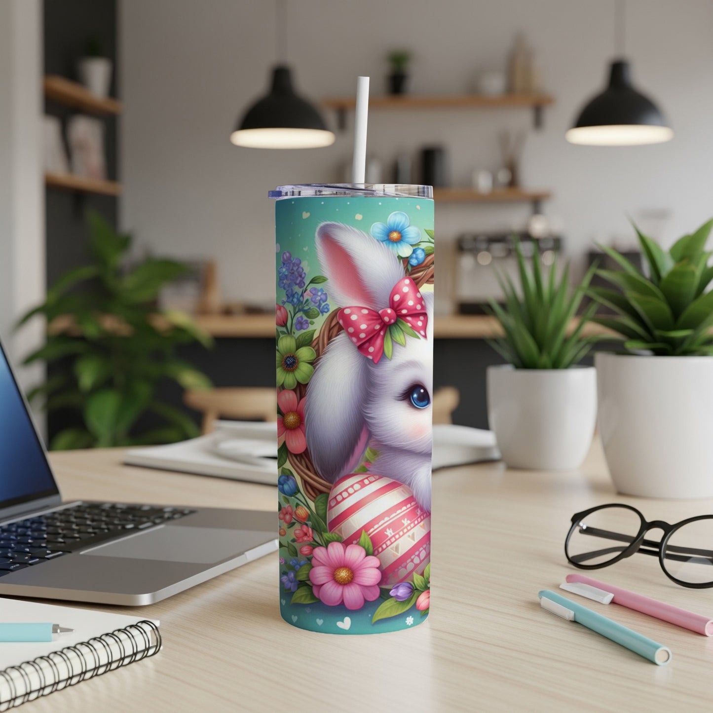 Easter bunny design on a white tumbler with a straw, floral accents, and pink bow.