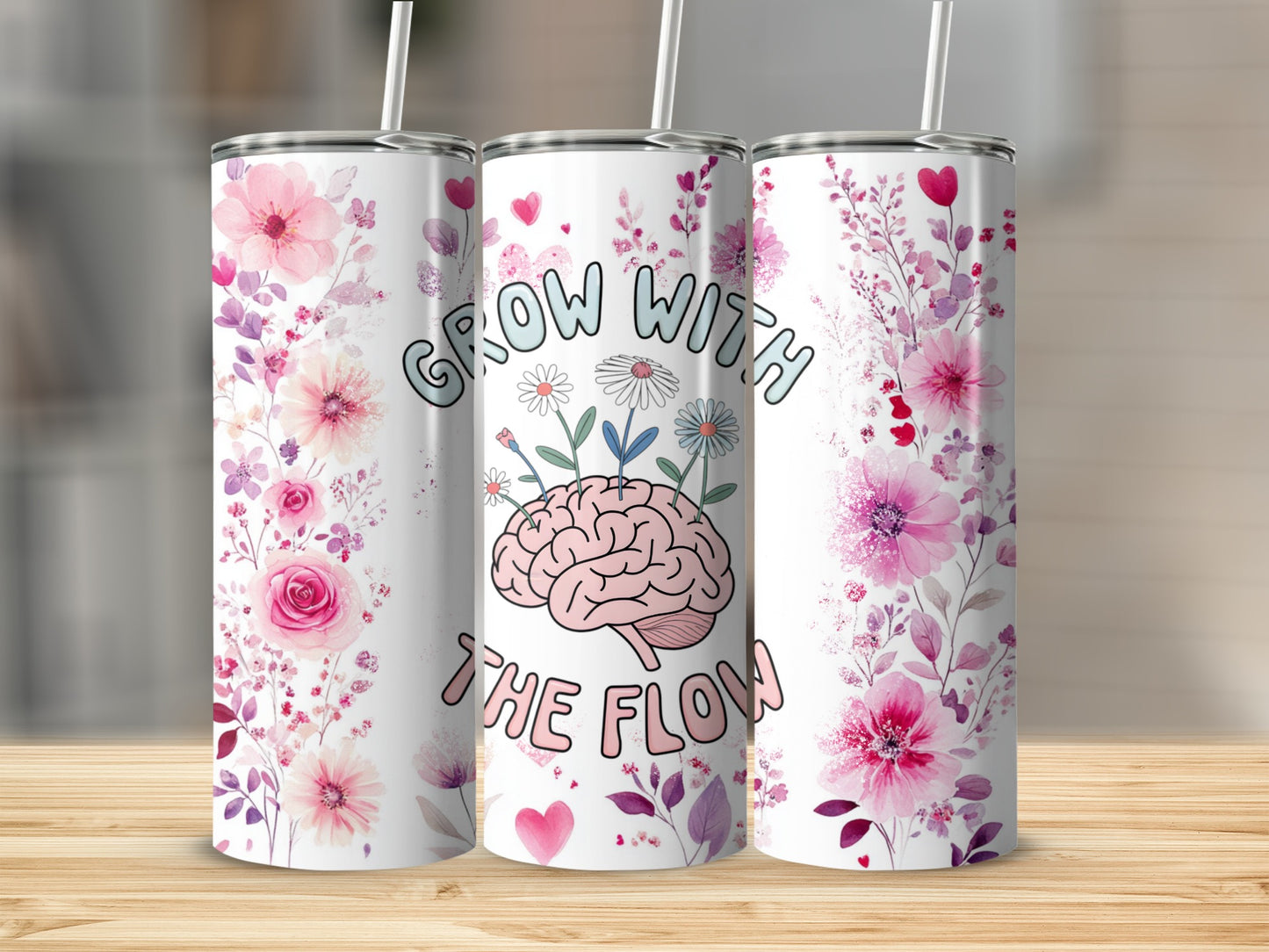 Tumbler with floral and brain design, "Grow with the Flow" text.