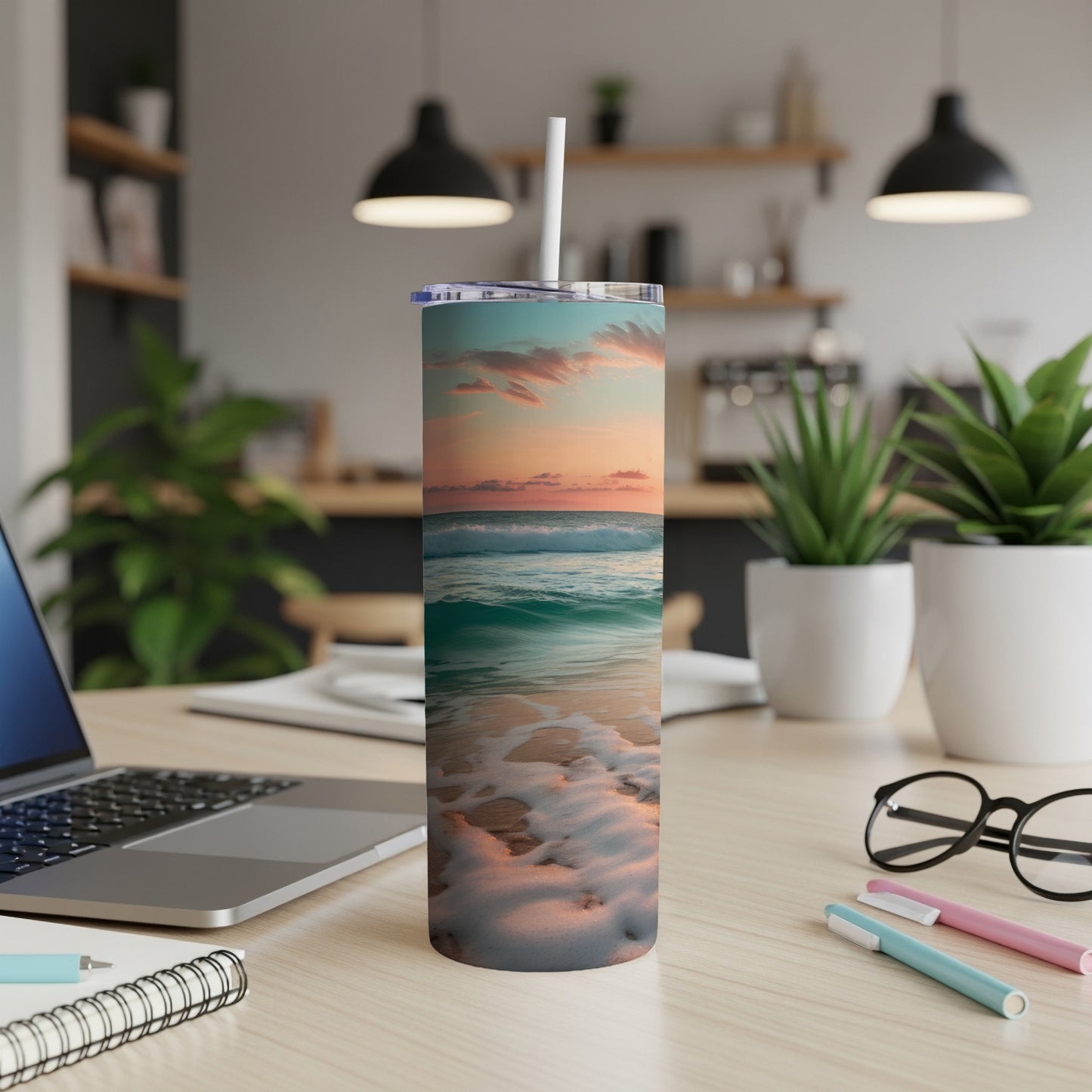 Tumbler with a serene ocean sunset waves and beach scene.