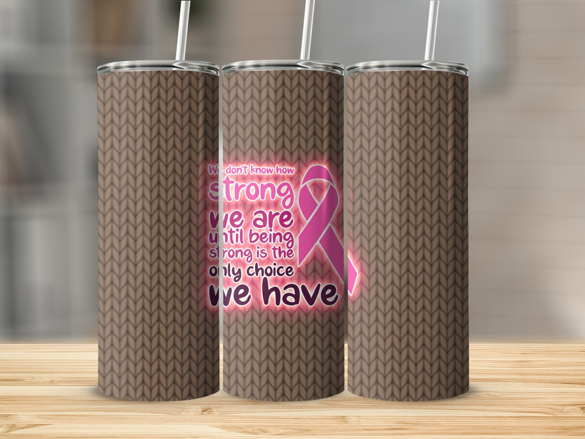 Three tumblers with a knitted brown pattern, featuring pink ribbon and inspirational text.