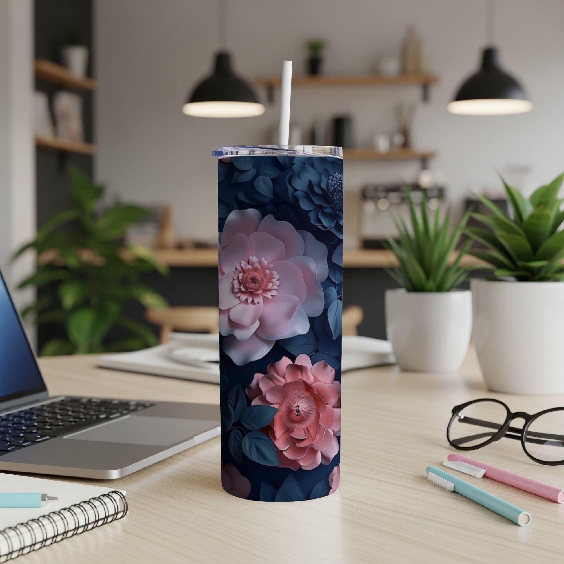 Dark blue tumbler with light pink and blue floral design.