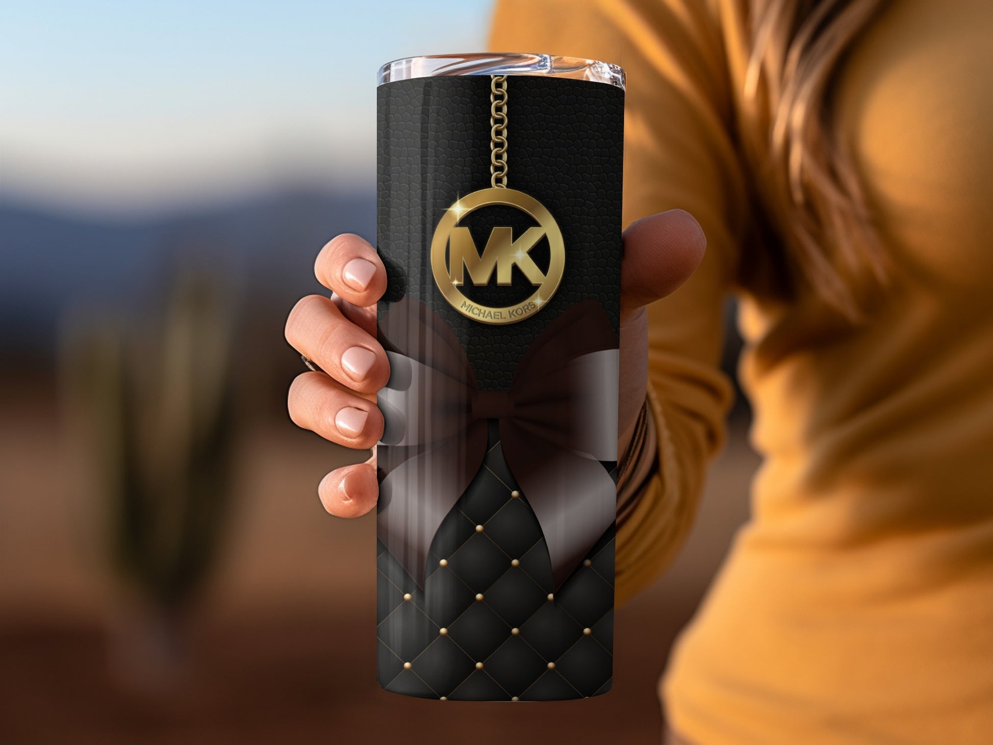Luxurious Black Tumbler with Elegant Gold Charm Design